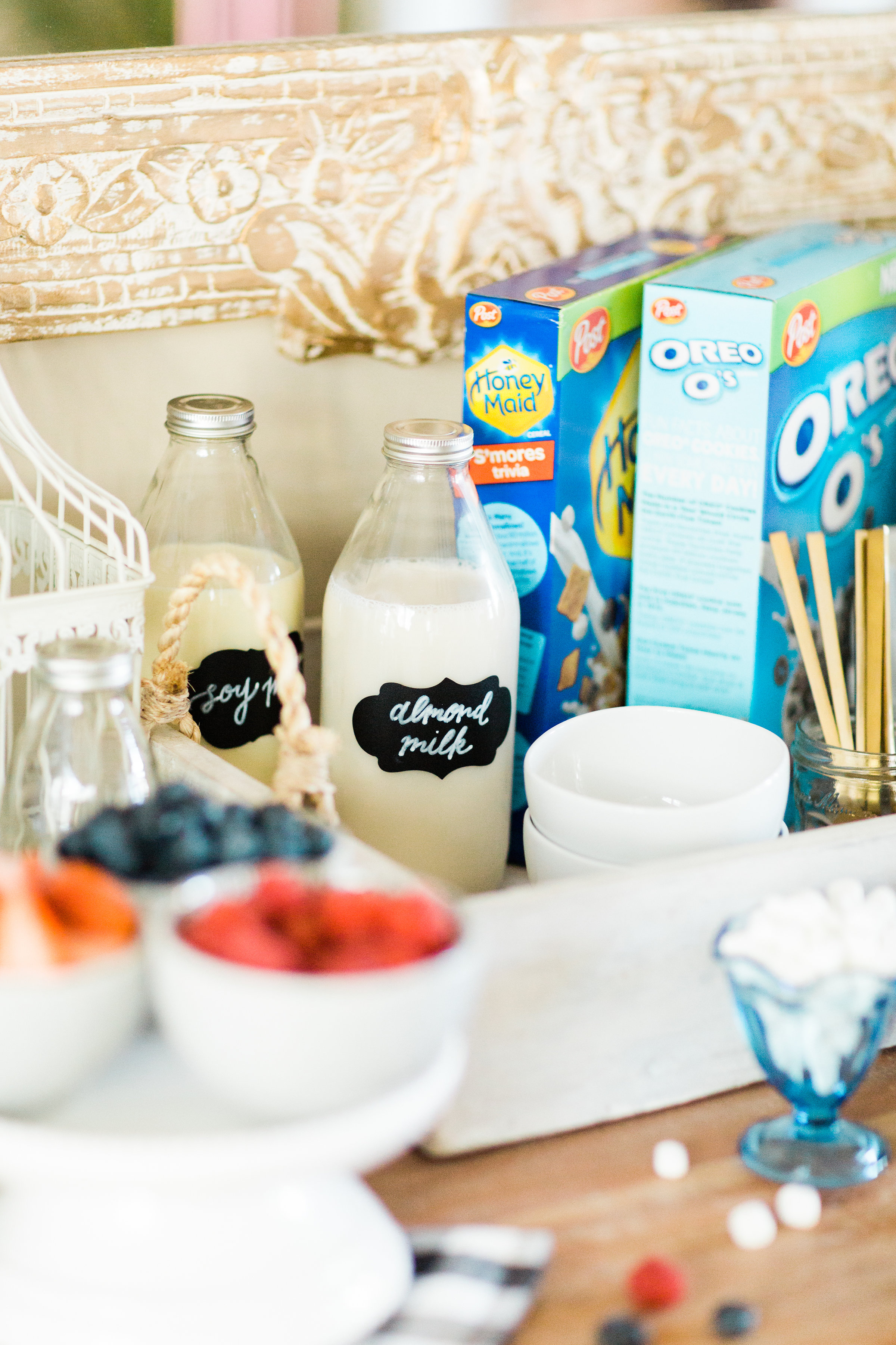 Looking for a unique and easy party dessert station? We're showing you how to put together a DIY retro cereal bar; perfect for a festive and memorable brunch, throwback party, pajama-themed soirée, or sleepover for your kids and their friends! Click through for the details. #brunch #brunchideas #cerealbar #cerealstation #party #partyideas #sleepoverparty #pajamaparty | glitterinc.com | @glitterinc