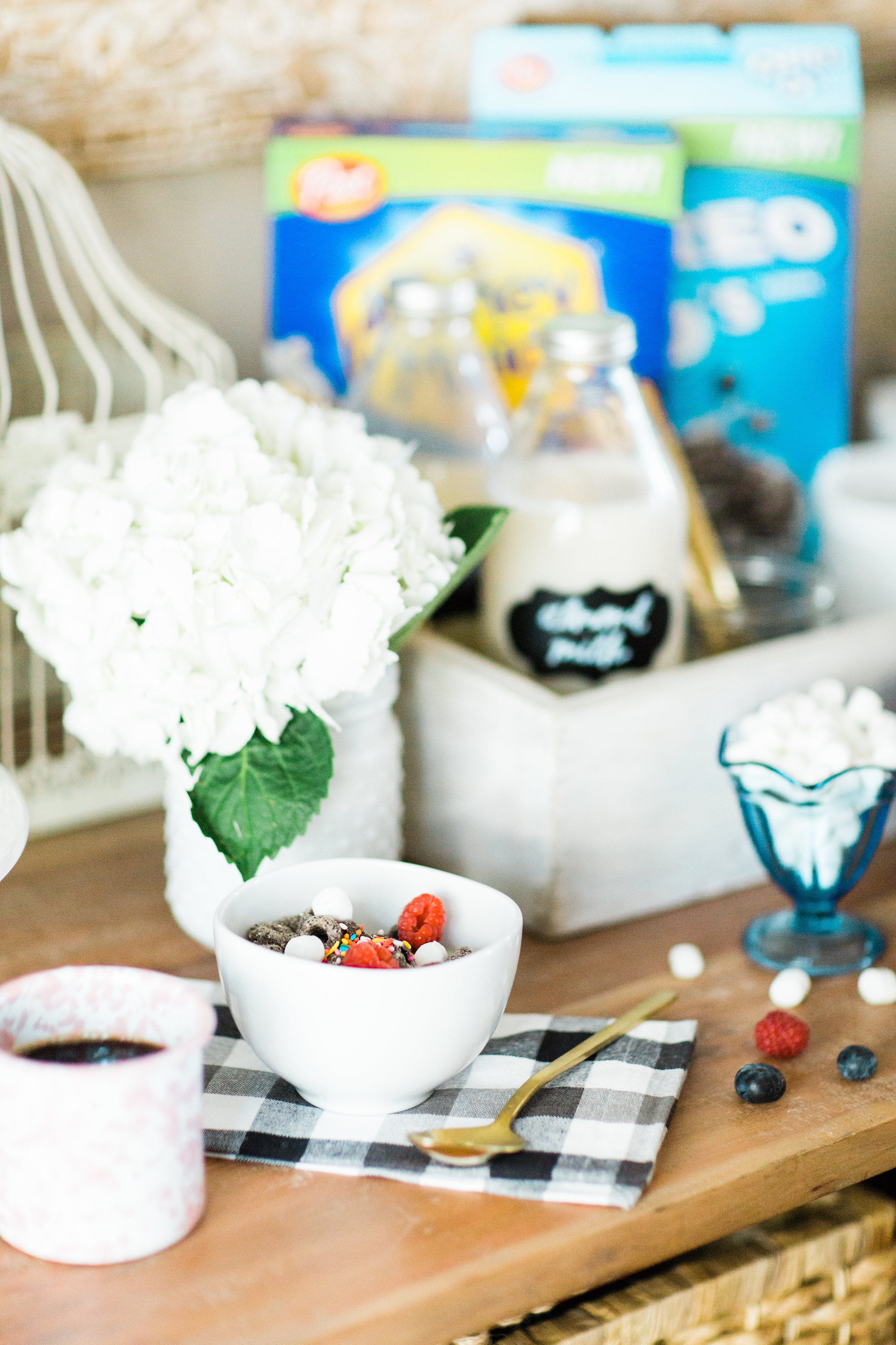 Looking for a unique and easy party dessert station? We're showing you how to put together a DIY retro cereal bar; perfect for a festive and memorable brunch, throwback party, pajama-themed soirée, or sleepover for your kids and their friends! Click through for the details. #brunch #brunchideas #cerealbar #cerealstation #party #partyideas #sleepoverparty #pajamaparty | glitterinc.com | @glitterinc