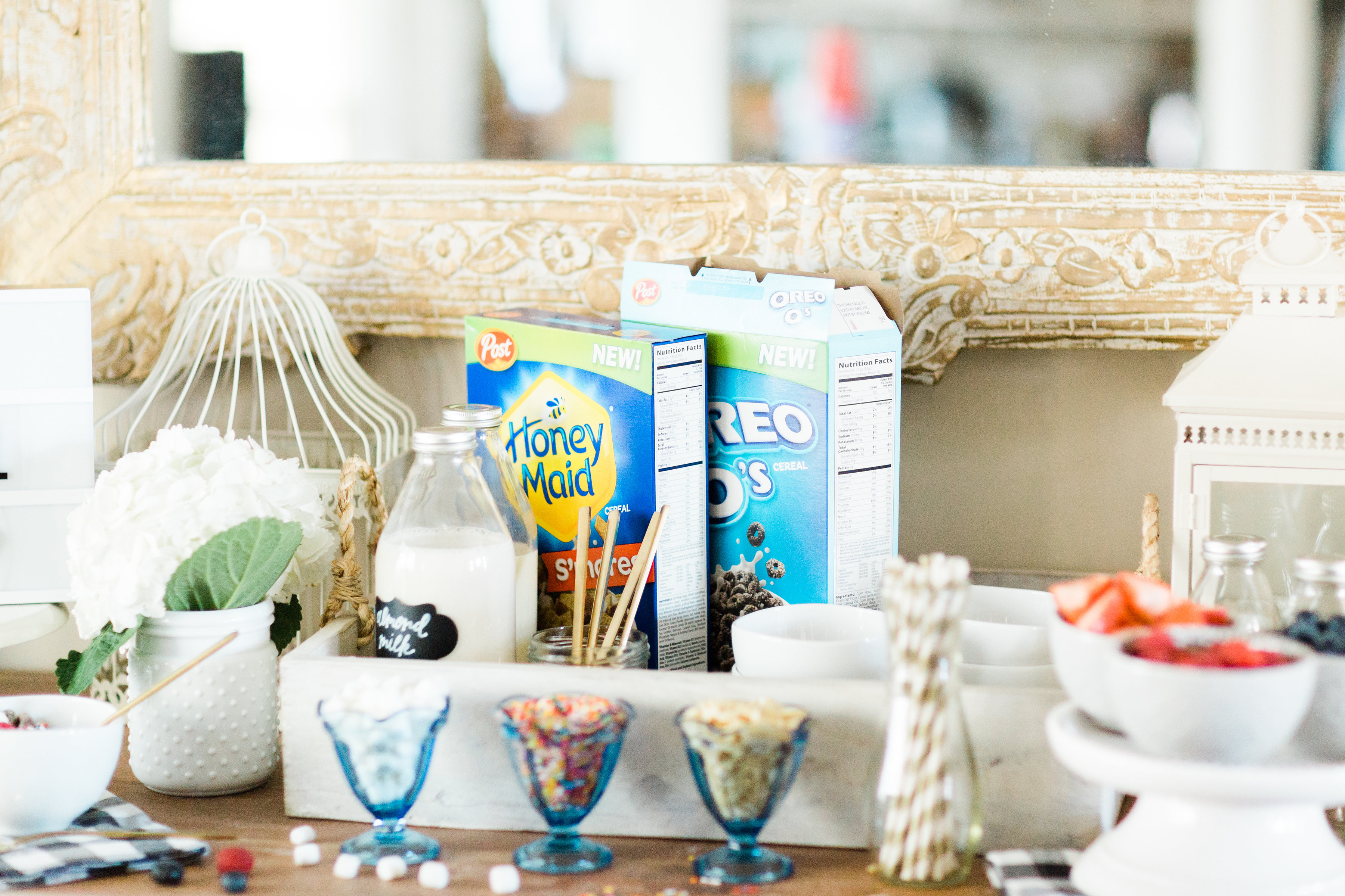 Looking for a unique and easy party dessert station? We're showing you how to put together a DIY retro cereal bar; perfect for a festive and memorable brunch, throwback party, pajama-themed soirée, or sleepover for your kids and their friends! Click through for the details. #brunch #brunchideas #cerealbar #cerealstation #party #partyideas #sleepoverparty #pajamaparty | glitterinc.com | @glitterinc