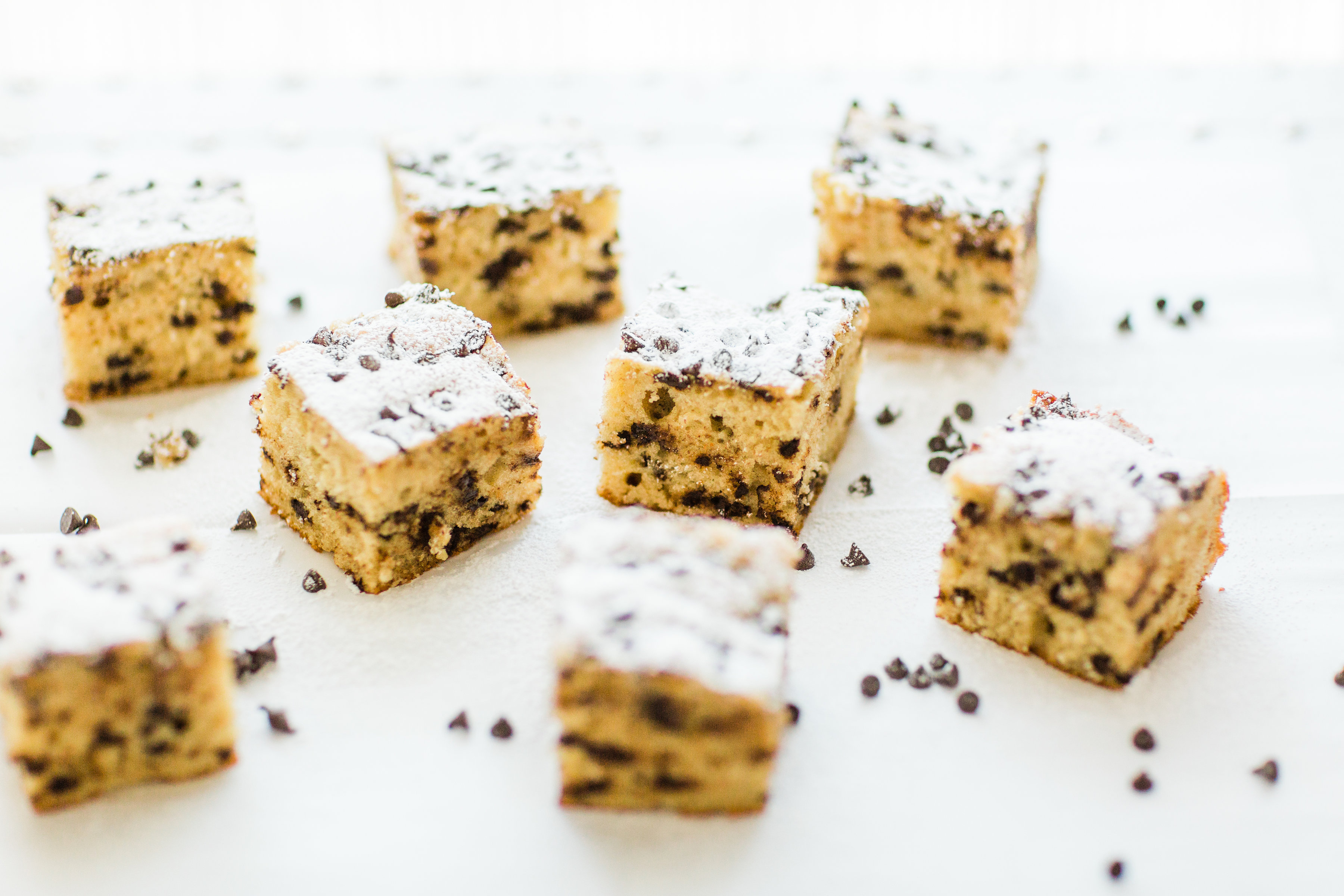 I wish I could properly put into words how amazing this chocolate chip snack cake is. It's nostalgia and buttery, moist decadent melty chocolate-y cake all in one. Click through for the recipe. | glitterinc.com | @glitterinc - Chocolate Chip Snack Cake by North Carolina foodie blogger Glitter, Inc.