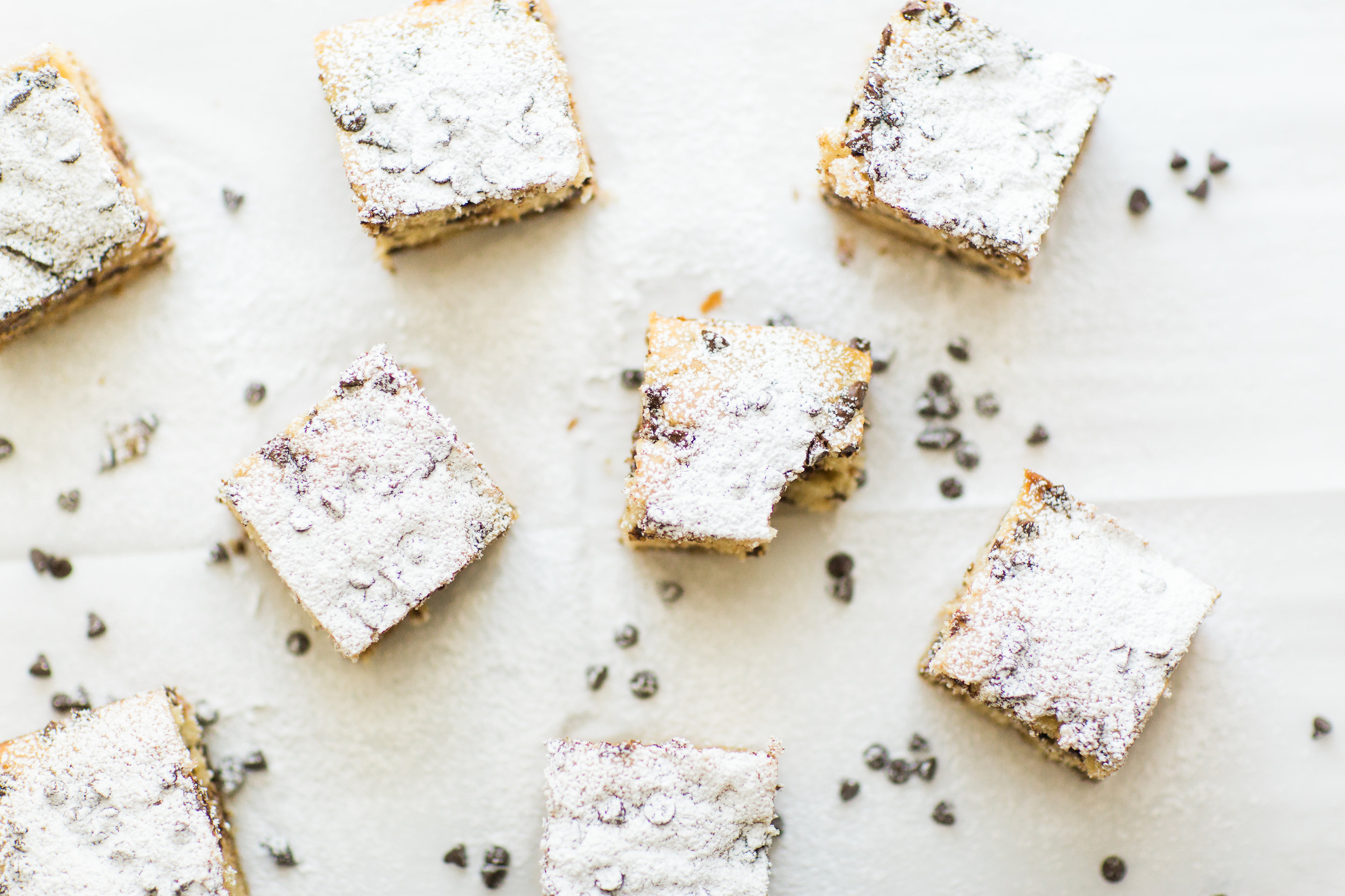 I wish I could properly put into words how amazing this chocolate chip snack cake is. It's nostalgia and buttery, moist decadent melty chocolate-y cake all in one. Click through for the recipe. | glitterinc.com | @glitterinc - Chocolate Chip Snack Cake by North Carolina foodie blogger Glitter, Inc