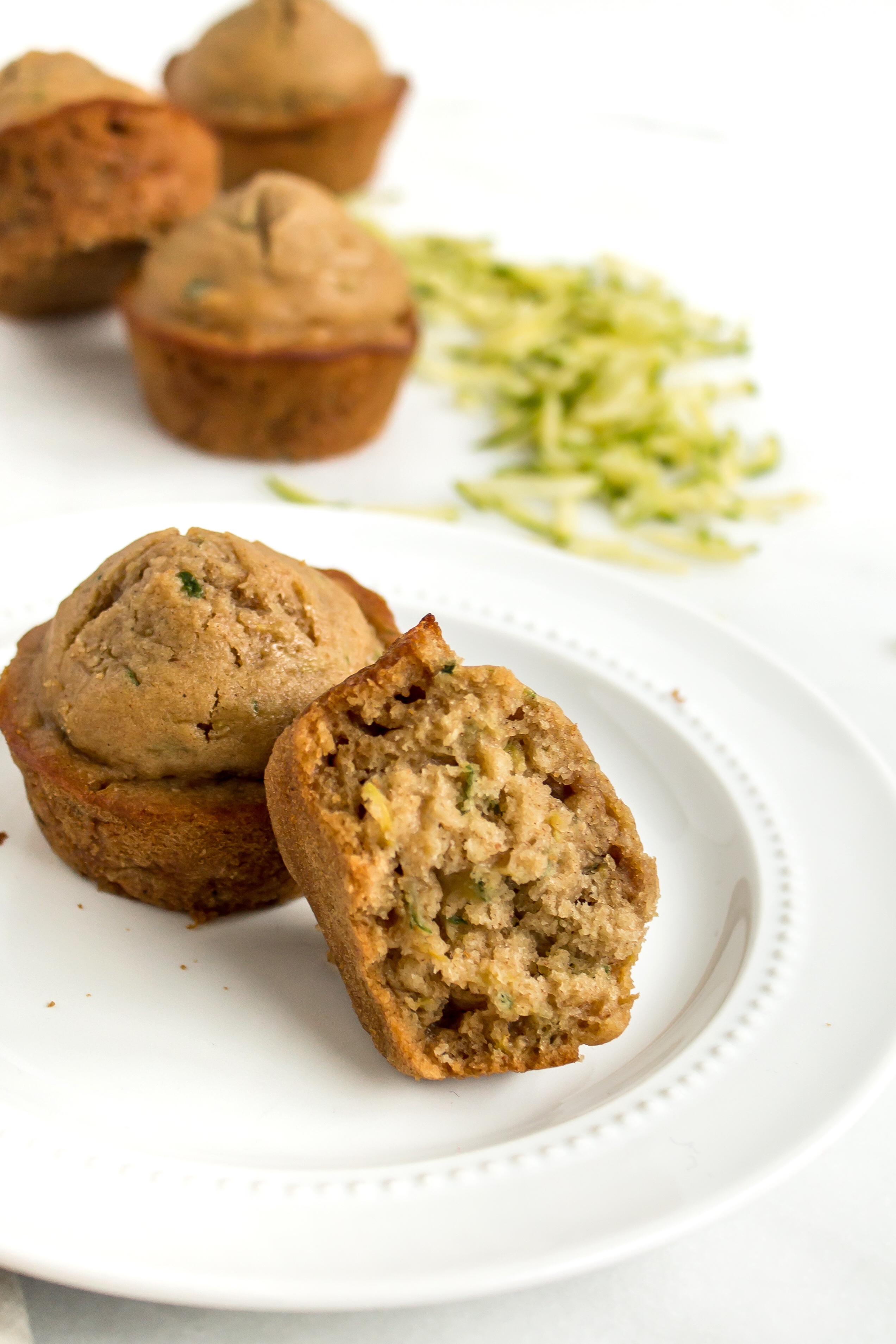 Zucchini muffins that are easy and totally delicious? And healthier too? Look no further! This recipe is for you. | glitterinc.com | @glitterinc - Healthier Zucchini Muffins Recipe by popular North Carolina foodie blog Glitter, Inc.