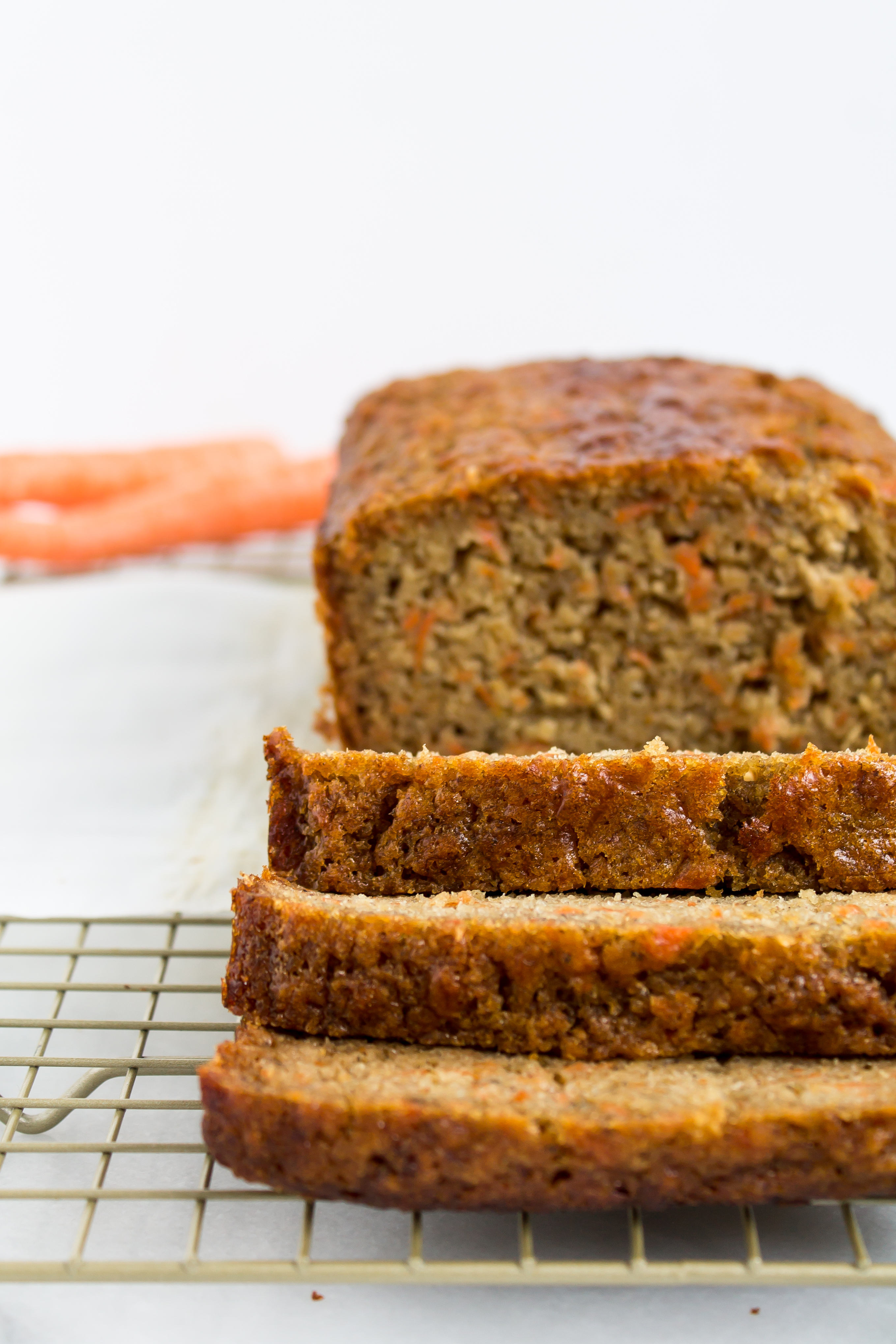 Love carrot cake? Love banana bread? This cross between a delicious carrot cake and your favorite moist slice of classic banana bread is going to become a fast favorite. Click through for the recipe. | glitterinc.com | @glitterinc - Carrot Banana Bread by popular North Carolina foodie blog Glitter, Inc.