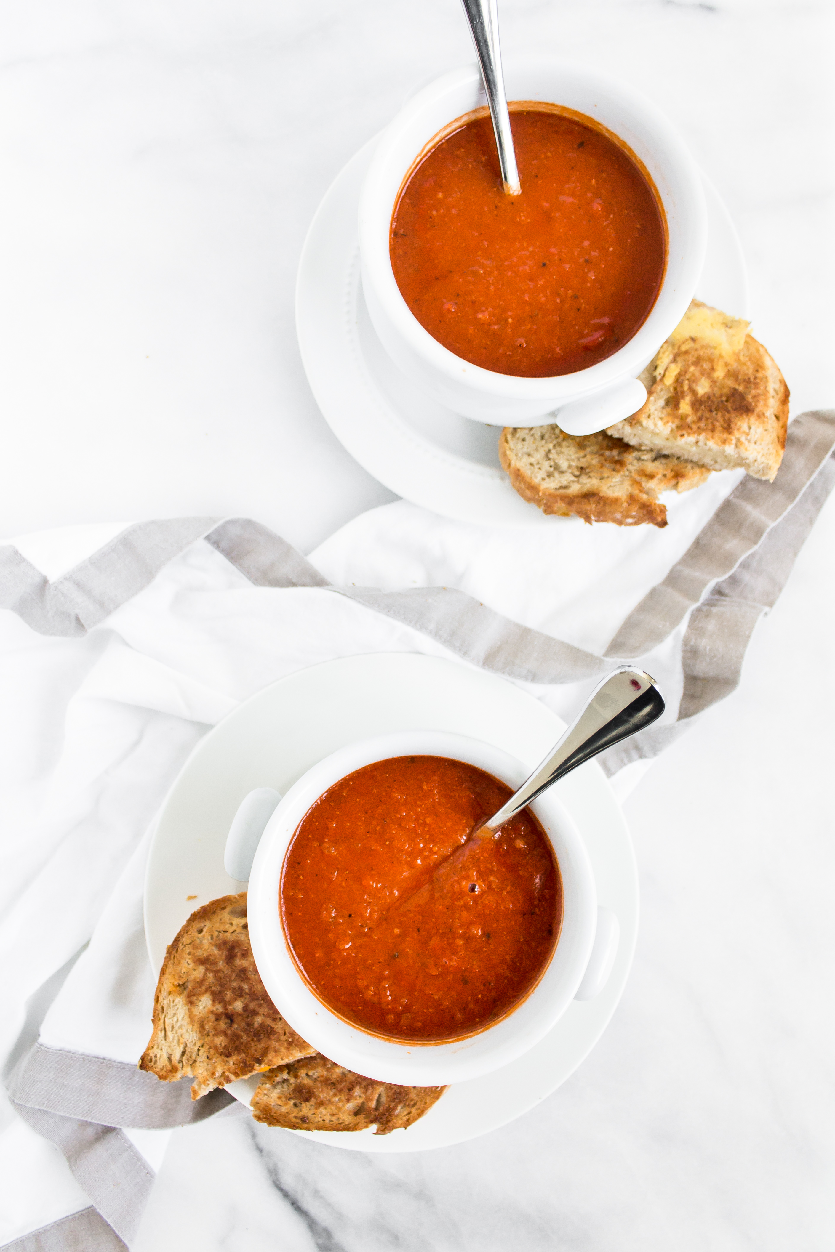 Looking for an easy and delicious healthier soup for dinner? You'll love this spin on classic tomato soup. It's dairy-free using one very cool secret ingredient that keeps it healthier and protein-packed. Click through for the recipe. | glitterinc.com | @glitterinc - Healthier Protein-Packed Classic Tomato Soup by popular North Carolina foodie blogger Glitter, Inc.