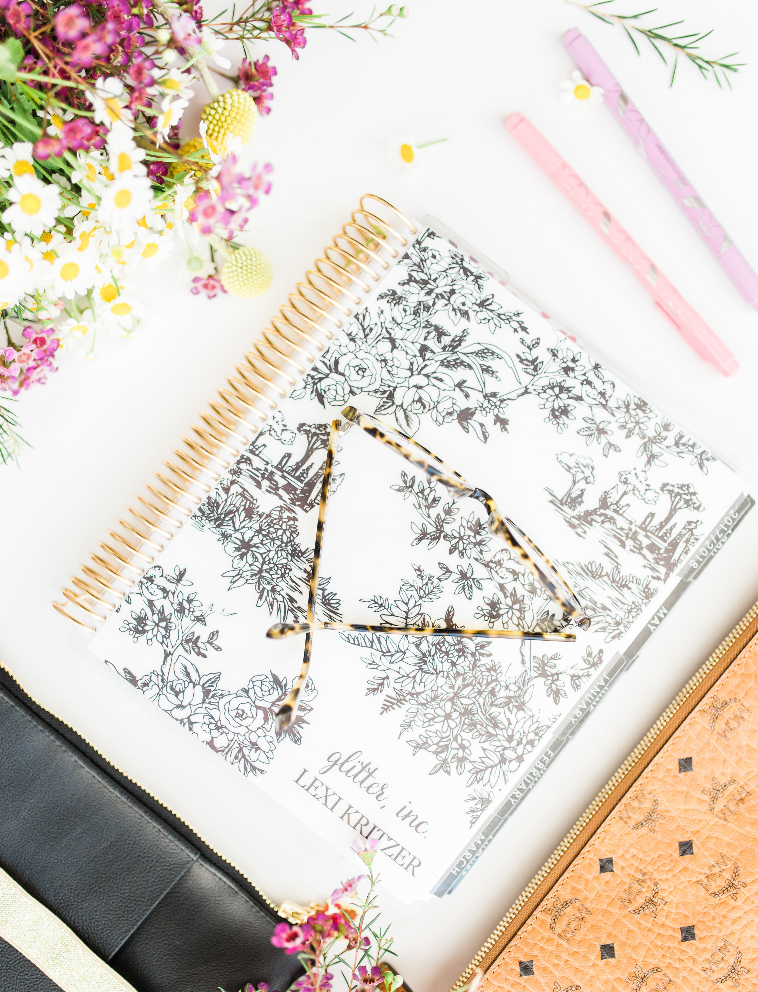 the Erin Condren LifePlanner and eyeglasses 