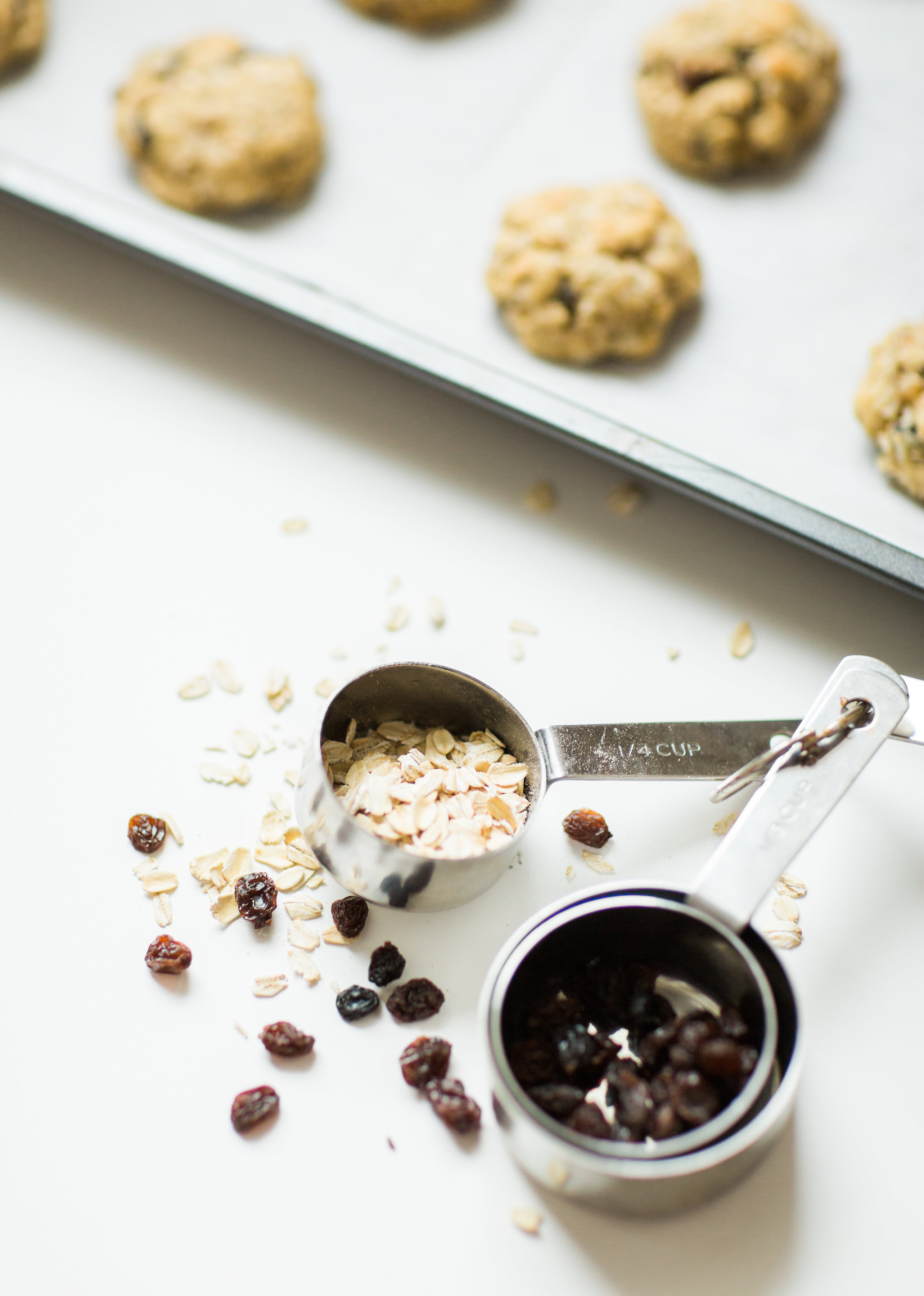 I've found the perfect oatmeal cookies for our family. Crispy on the outside and super soft on the inside, they taste just slightly under-baked; and, bonus - they're dairy-free and can be made gluten-free.Click through for the recipe. | glitterinc.com | @glitterinc - Favorite Oatmeal Raisin Cookies Recipe by popular North Carolina foodie blogger Glitter, Inc.