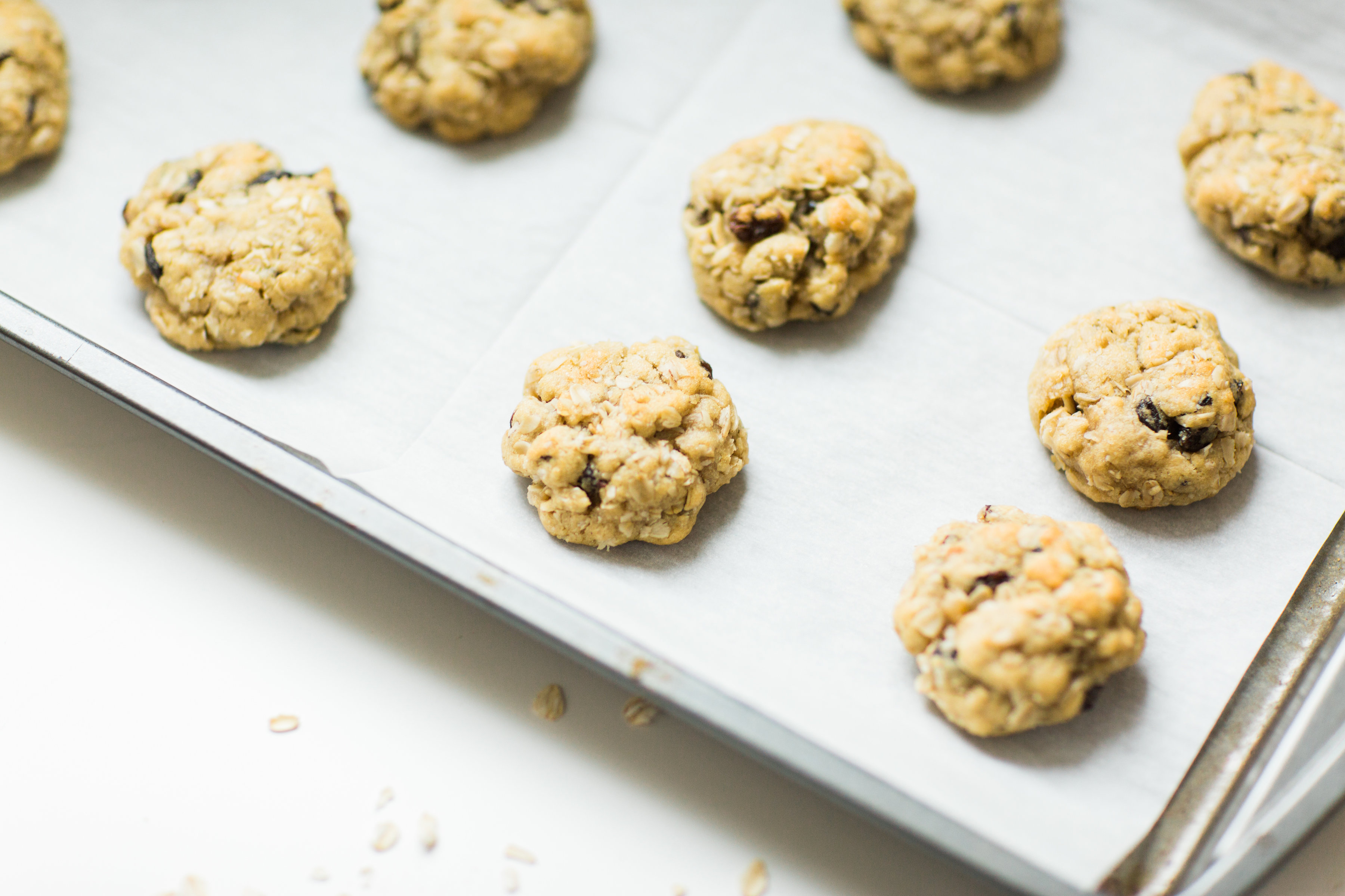 I've found the perfect oatmeal cookies for our family. Crispy on the outside and super soft on the inside, they taste just slightly under-baked; and, bonus - they're dairy-free and can be made gluten-free.Click through for the recipe. | glitterinc.com | @glitterinc - Favorite Oatmeal Raisin Cookies Recipe by popular North Carolina foodie blogger Glitter, Inc.