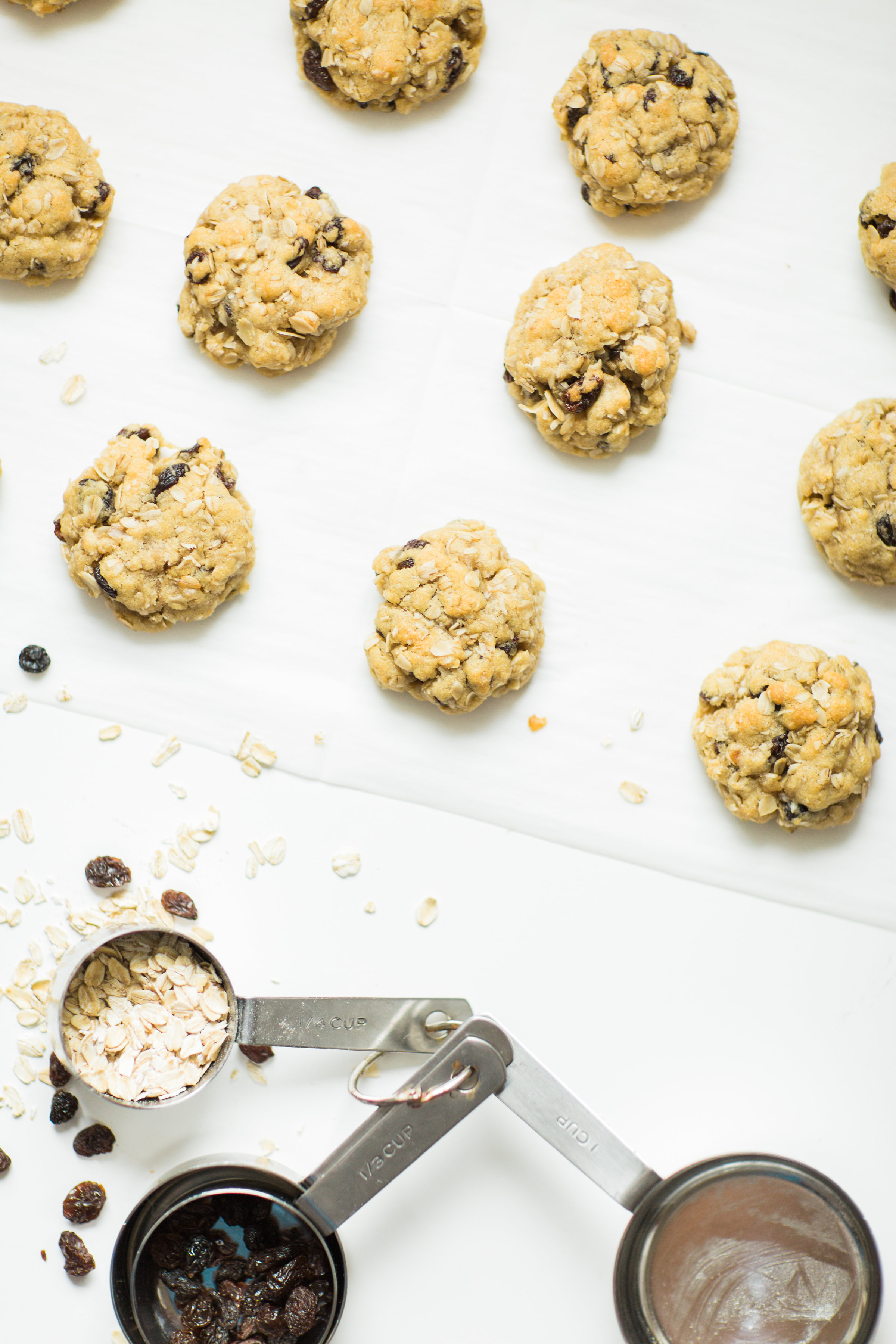 I've found the perfect oatmeal cookies for our family. Crispy on the outside and super soft on the inside, they taste just slightly under-baked; and, bonus - they're dairy-free and can be made gluten-free.Click through for the recipe. | glitterinc.com | @glitterinc - Favorite Oatmeal Raisin Cookies Recipe by popular North Carolina foodie blogger Glitter, Inc.