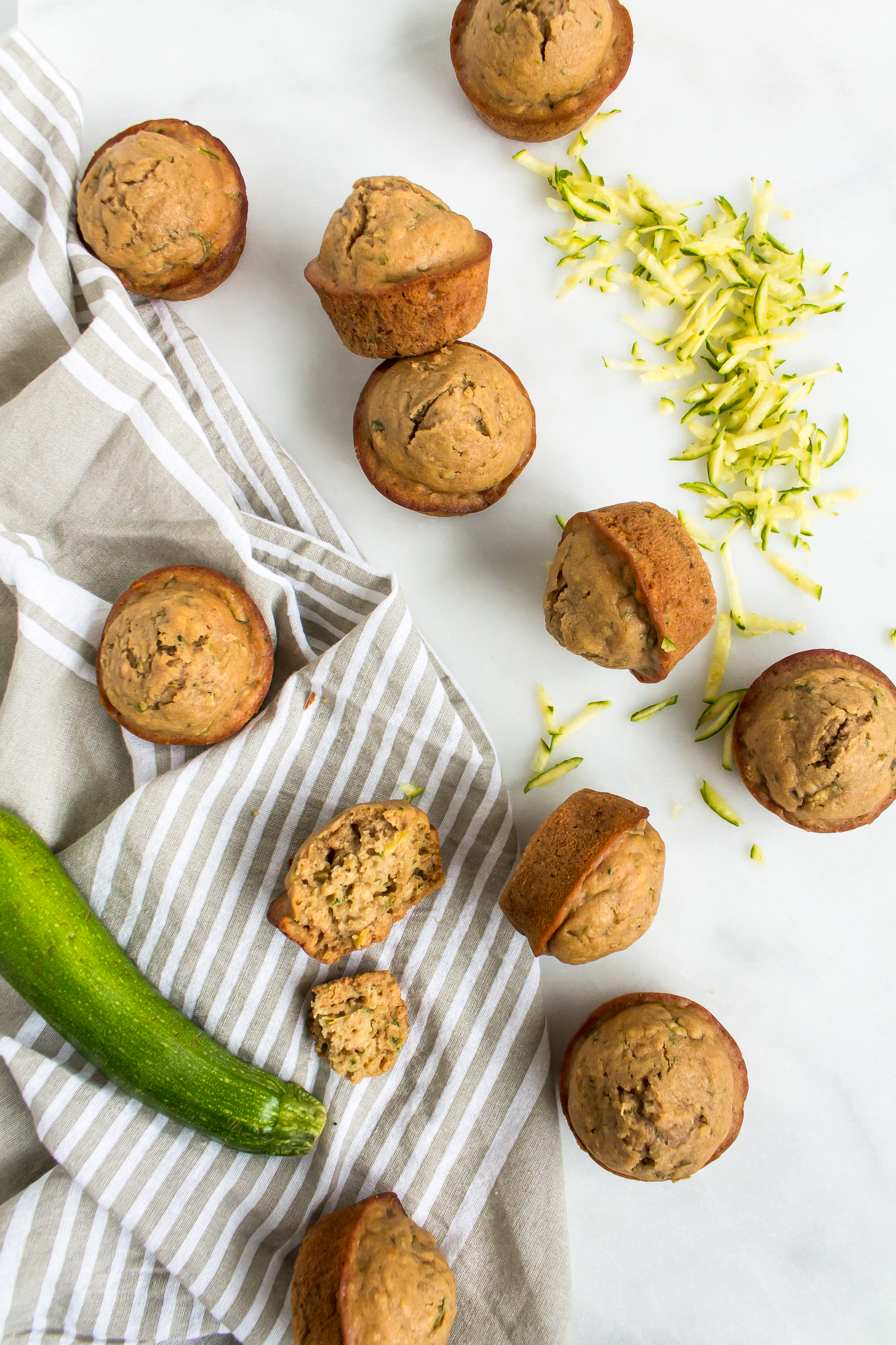 Zucchini muffins that are easy and totally delicious? And healthier too? Look no further! This recipe is for you. | glitterinc.com | @glitterinc - Healthier Zucchini Muffins Recipe by popular North Carolina foodie blog Glitter, Inc.