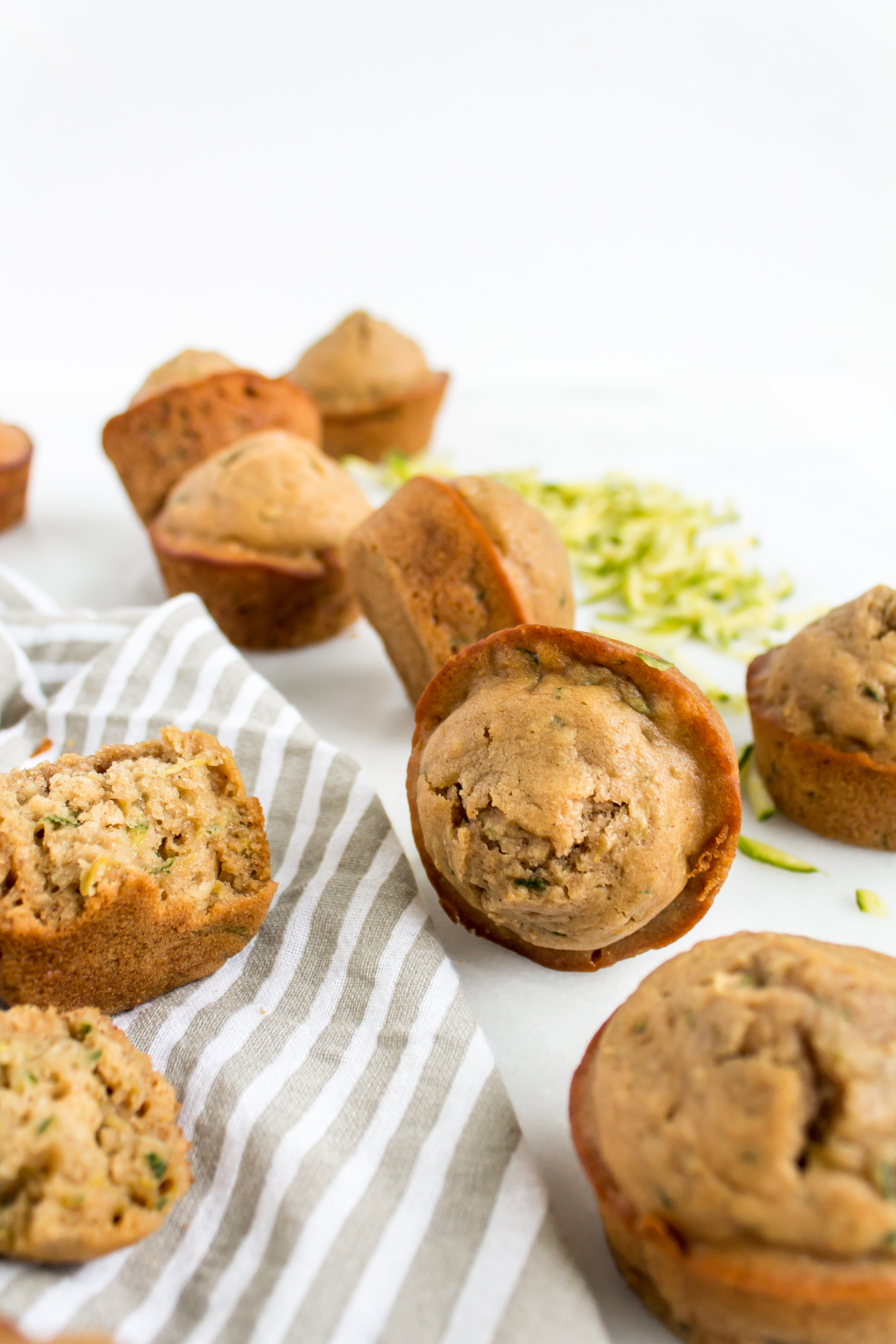 Zucchini muffins that are easy and totally delicious? And healthier too? Look no further! This recipe is for you. | glitterinc.com | @glitterinc - Healthier Zucchini Muffins Recipe by popular North Carolina foodie blog Glitter, Inc.