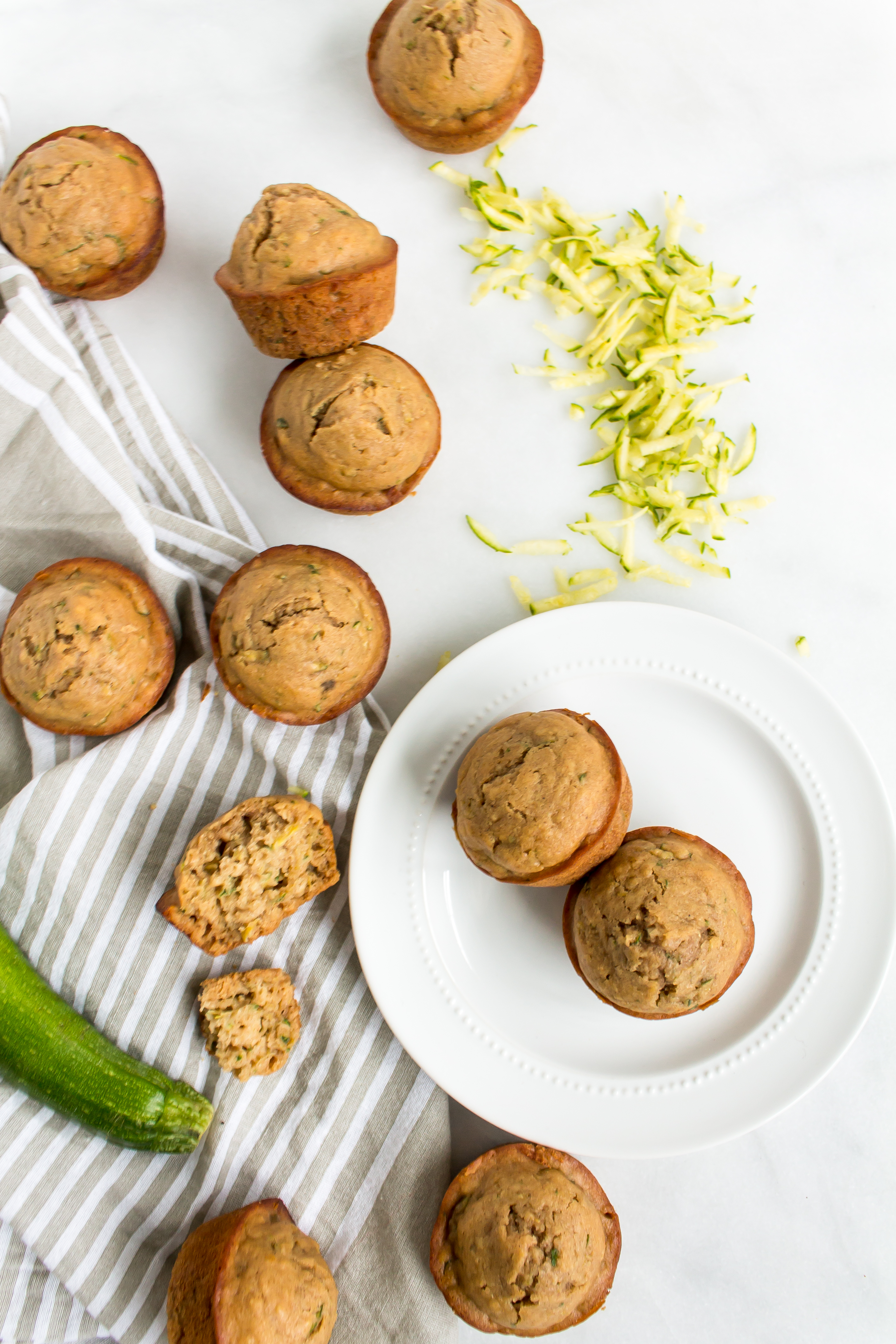 Zucchini muffins that are easy and totally delicious? And healthier too? Look no further! This recipe is for you. | glitterinc.com | @glitterinc - Healthier Zucchini Muffins Recipe by popular North Carolina foodie blog Glitter, Inc.