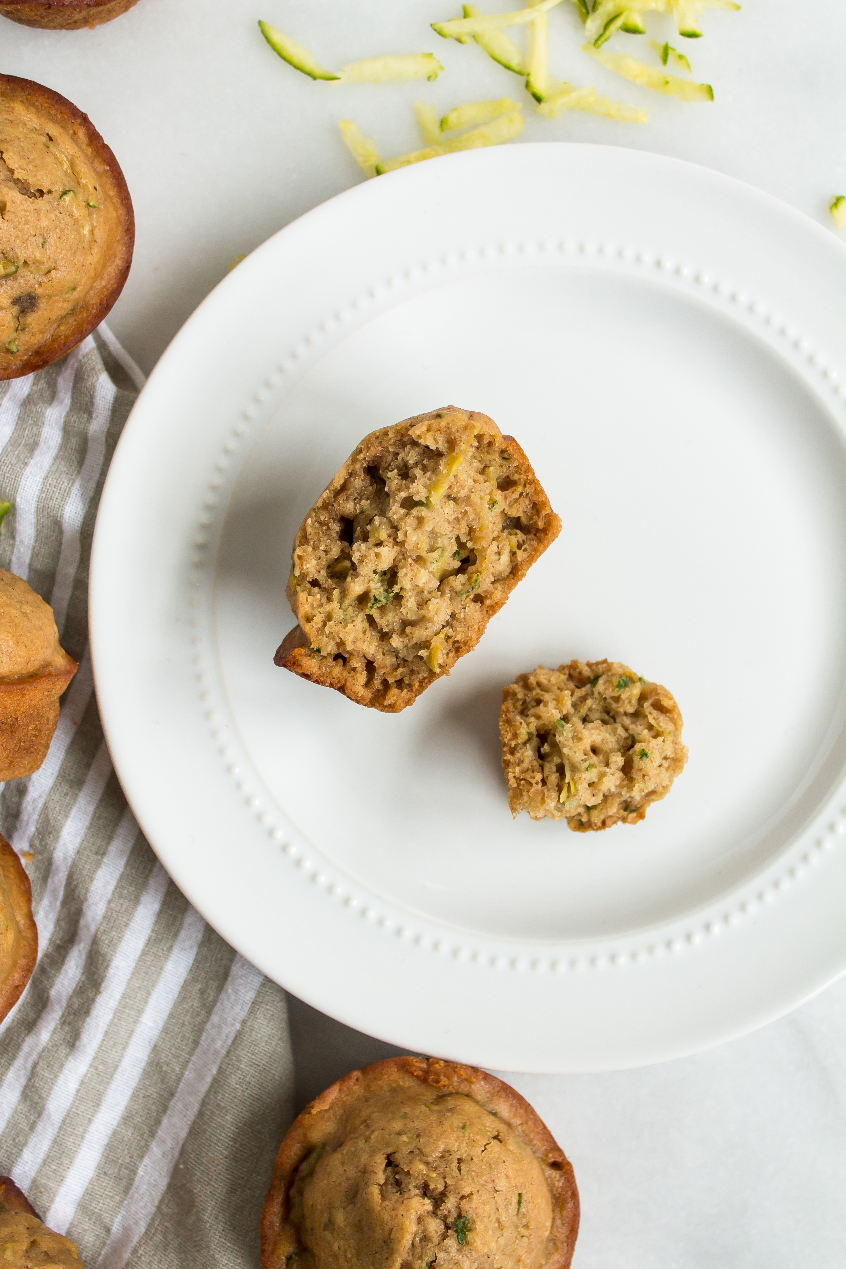 Zucchini muffins that are easy and totally delicious? And healthier too? Look no further! This recipe is for you. | glitterinc.com | @glitterinc - Healthier Zucchini Muffins Recipe by popular North Carolina foodie blog Glitter, Inc.