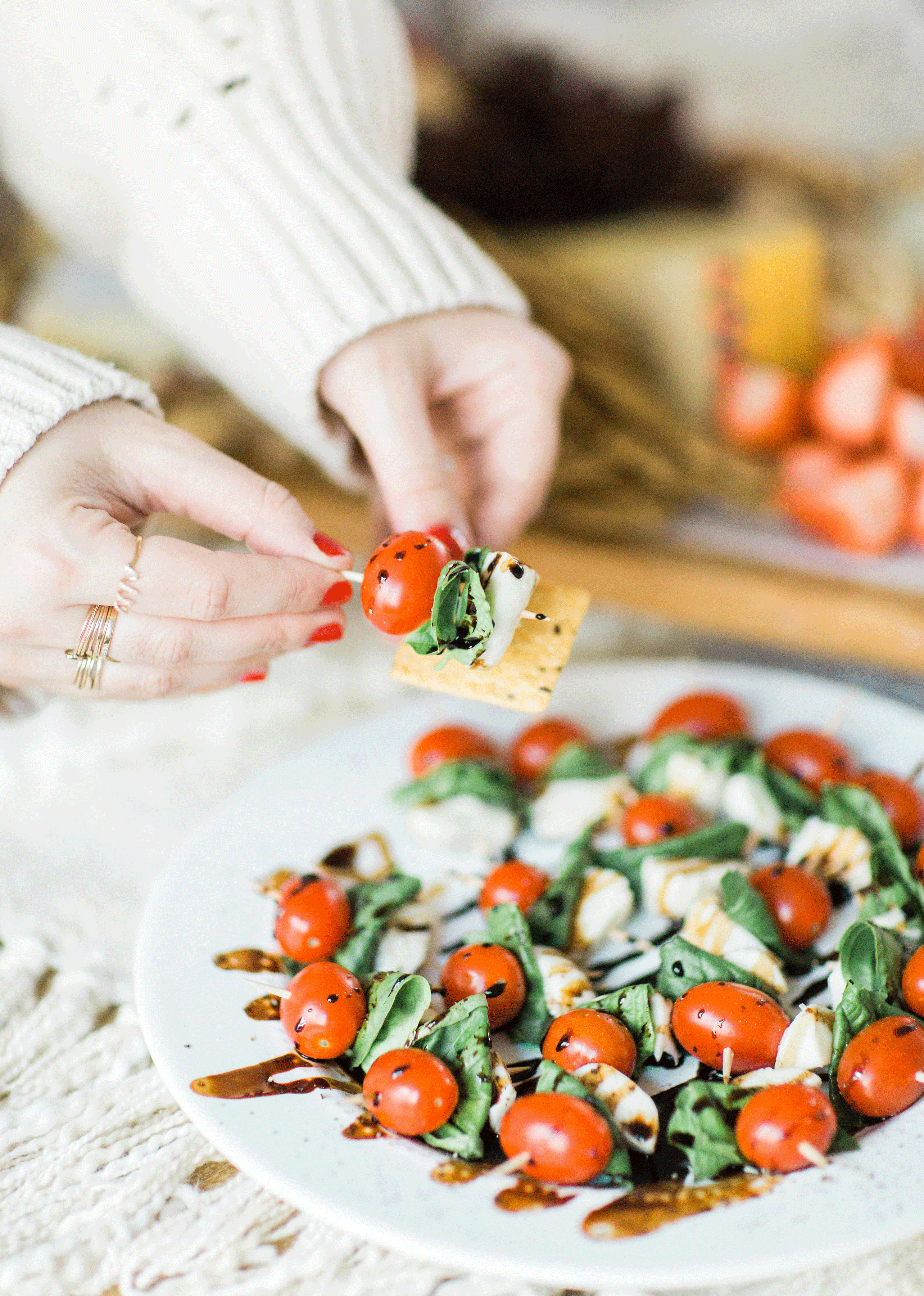 Need a super simple appetizer for your next party? These caprese skewers with balsamic drizzle couldn't be easier to put together, taste absolutely delicious, and are always a perfect crowd-pleaser! Click through for the recipe. | glitterinc.com | @glitterinc - Caprese Skewers With Balsamic Glaze featured by popular North Carolina food blogger, Glitter, Inc.