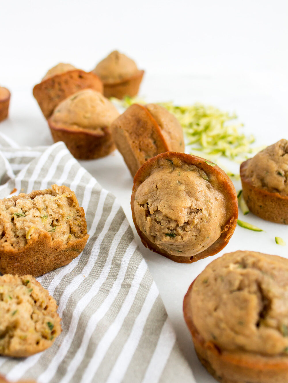 This recipe for moist and fluffy healthier zucchini muffins, is not only crazy good, but the result is dessert you can eat for breakfast (or literally any other reason), every single day. These also make a perfect healthy snack. Yum! | glitterinc.com | @glitterinc