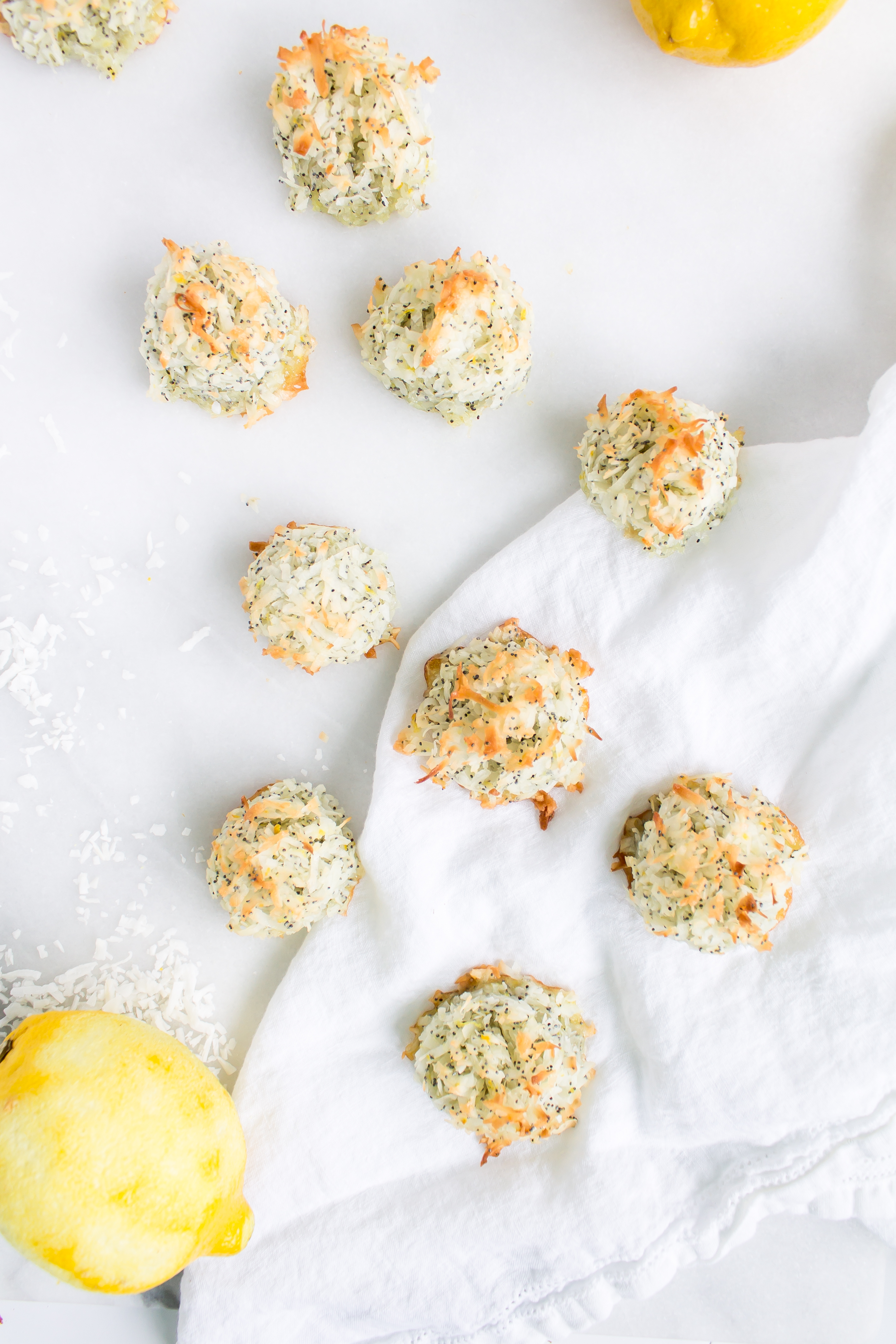 Coconut macaroons have the perfect balance of textures - crunchy on the outside, but moist and chewy on the inside. This lemon poppy seed version of the classic flourless cookie is packed with fresh, zesty citrus flavor for a wonderful spring or Passover treat! Click through for the recipe. | glitterinc.com | @glitterinc - Lemon Poppyseed Coconut Macaroons Recipe by popular North Carolina foodie blog Glitter, Inc.