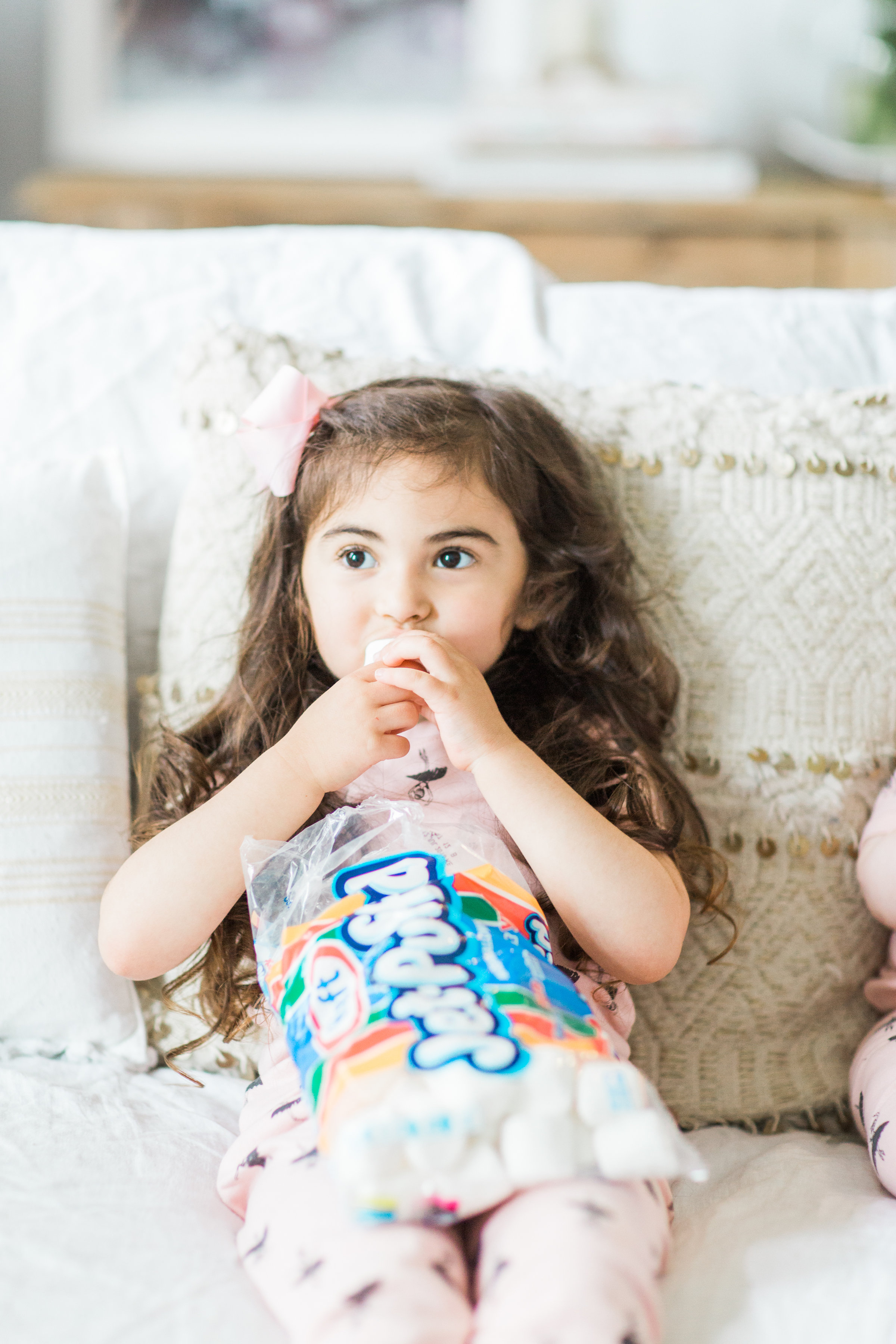 I'm sharing a big 'ol dose of cuteness; a.k.a., the behind-the-scenes of the girls trying s'mores for the first time (and caught on camera) from our family movie night! #smores #matchingpajamas #movienight #familyfun #smoresparty | glitterinc.com | @glitterinc