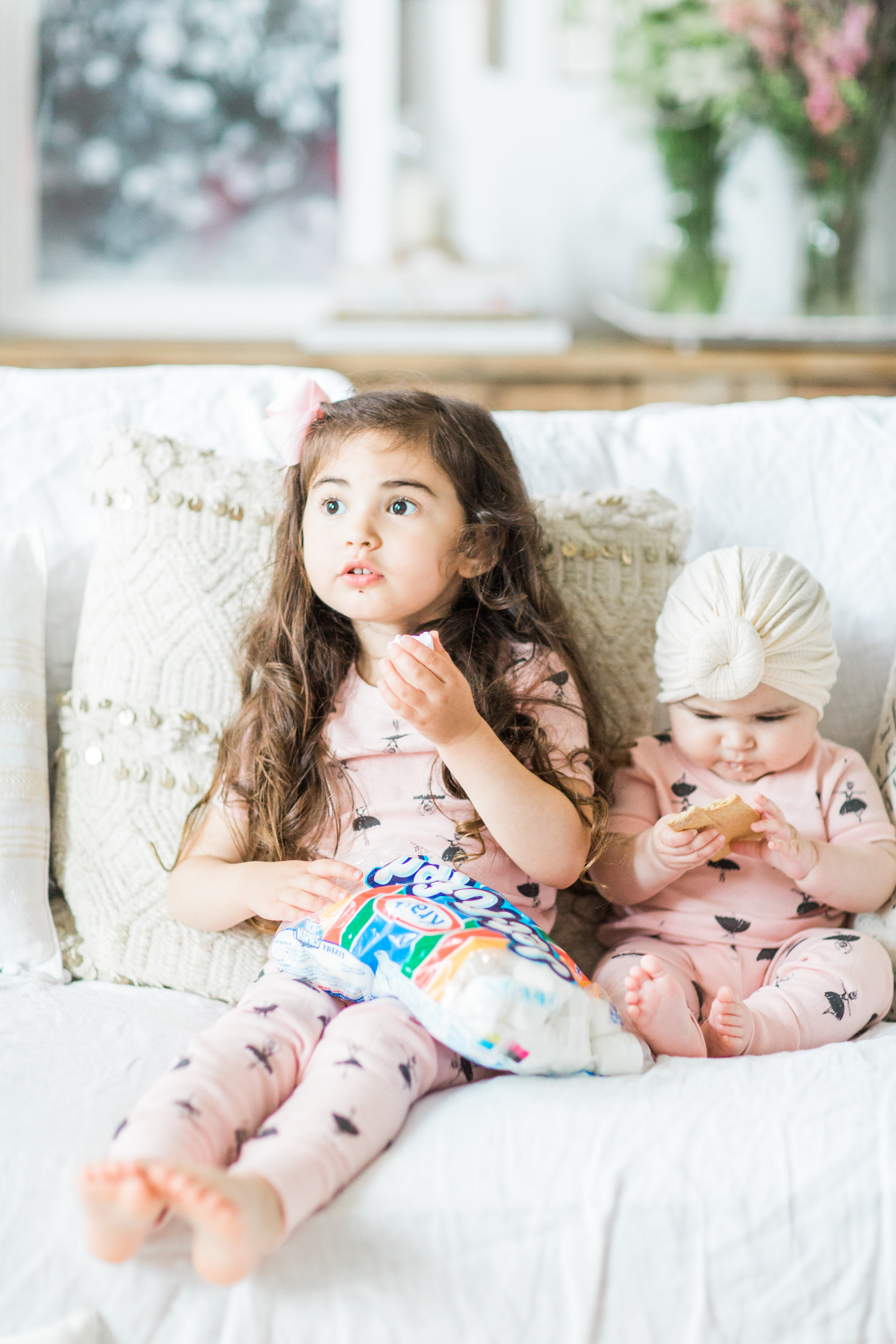 I'm sharing a big 'ol dose of cuteness; a.k.a., the behind-the-scenes of the girls trying s'mores for the first time (and caught on camera) from our family movie night! #smores #matchingpajamas #movienight #familyfun #smoresparty | glitterinc.com | @glitterinc