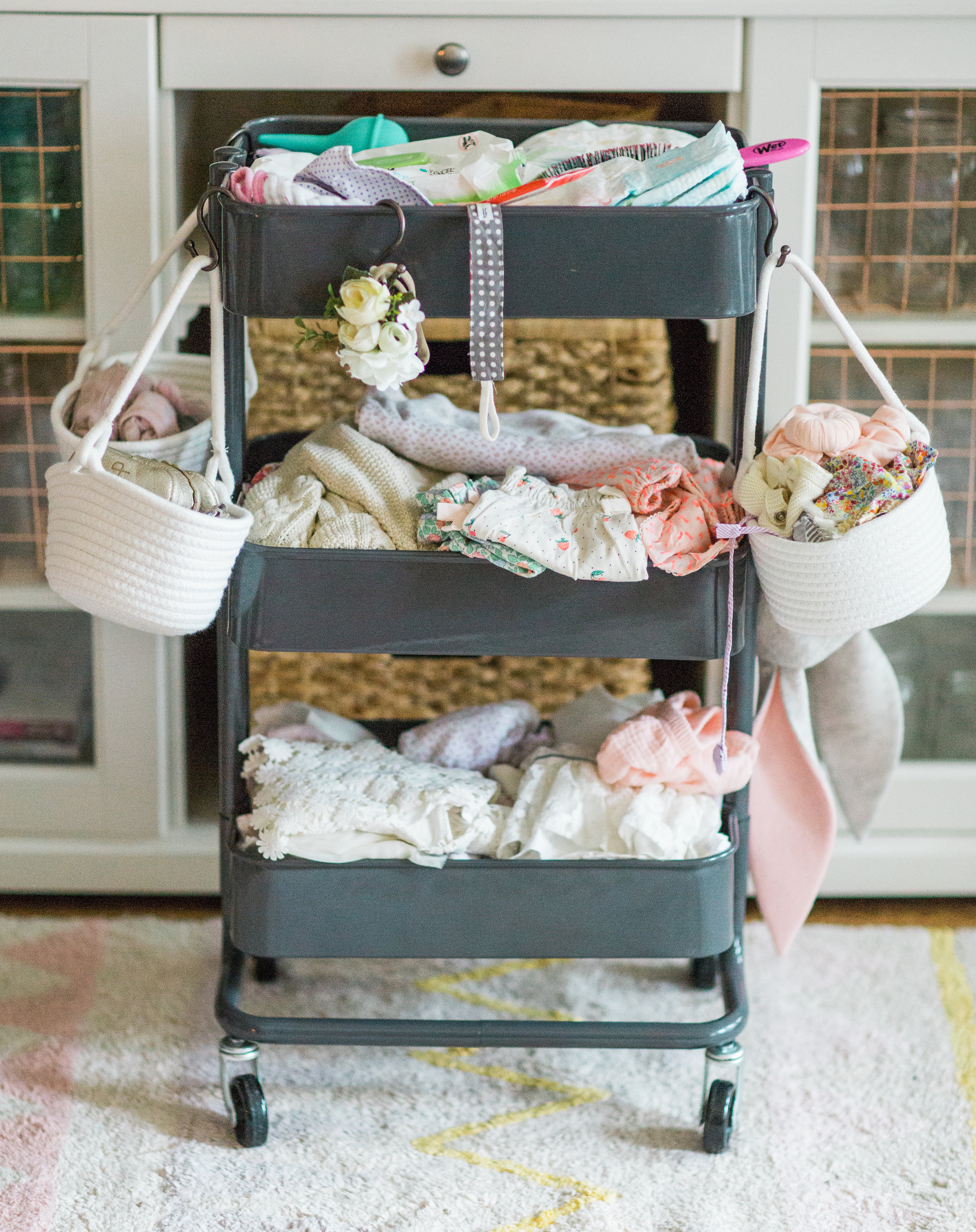 Making life easier with a new baby is the name of the game. Mom blogger Lexi of Glitter, Inc. shares a DIY new baby changing station using everyone's favorite Ikea RÅSKOG Cart. #diy #ikeahack #ikeacart #ikearaskogcart #babychangingstation #babychangingcart #changingstation #changingcart #diaperorganization #baby #newbaby | Click through for the details. | glitterinc.com | @glitterinc