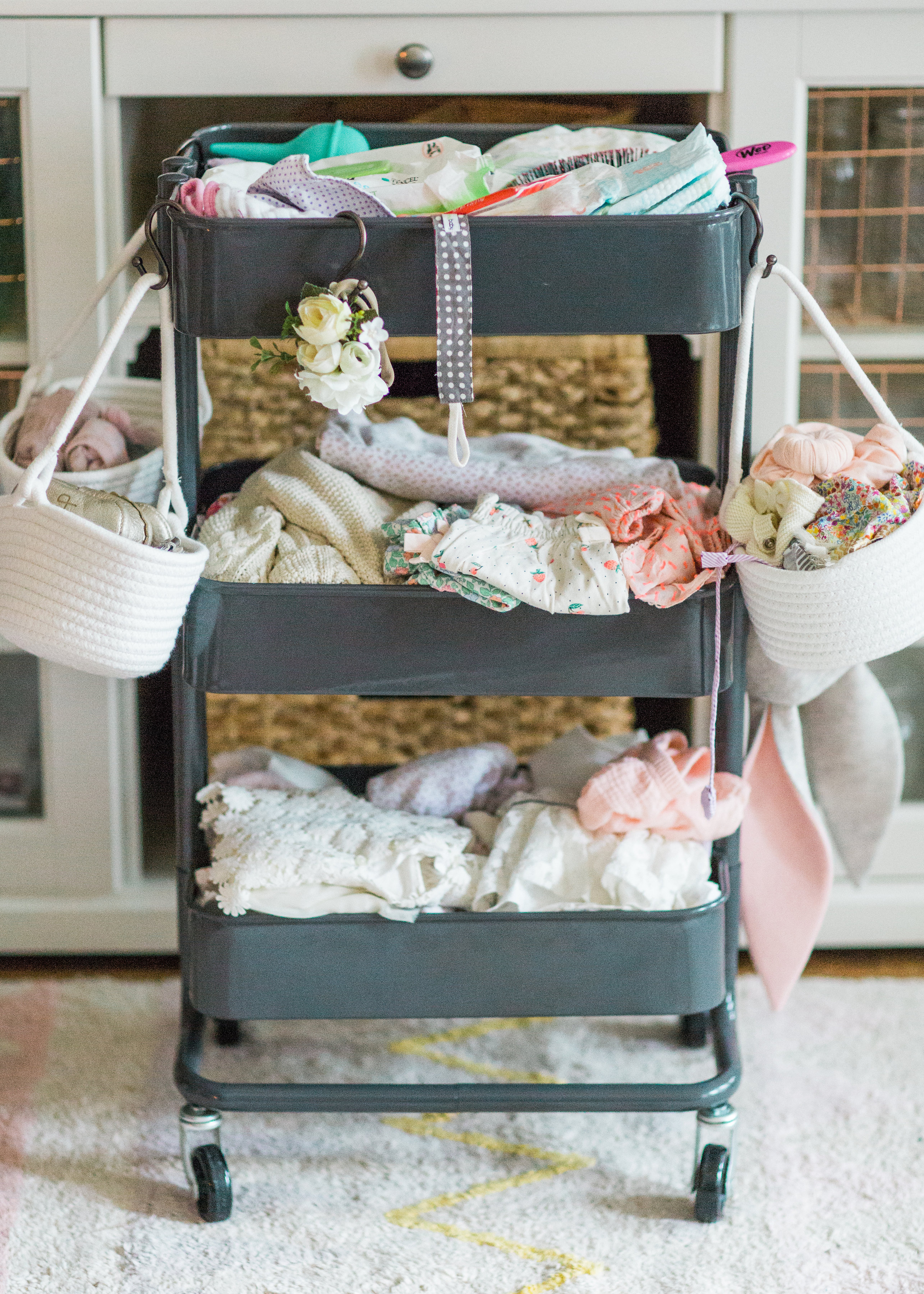 Making life easier with a new baby is the name of the game. Mom blogger Lexi of Glitter, Inc. shares a DIY new baby changing station using everyone's favorite Ikea RÅSKOG Cart. #diy #ikeahack #ikeacart #ikearaskogcart #babychangingstation #babychangingcart #changingstation #changingcart #diaperorganization #baby #newbaby | Click through for the details. | glitterinc.com | @glitterinc