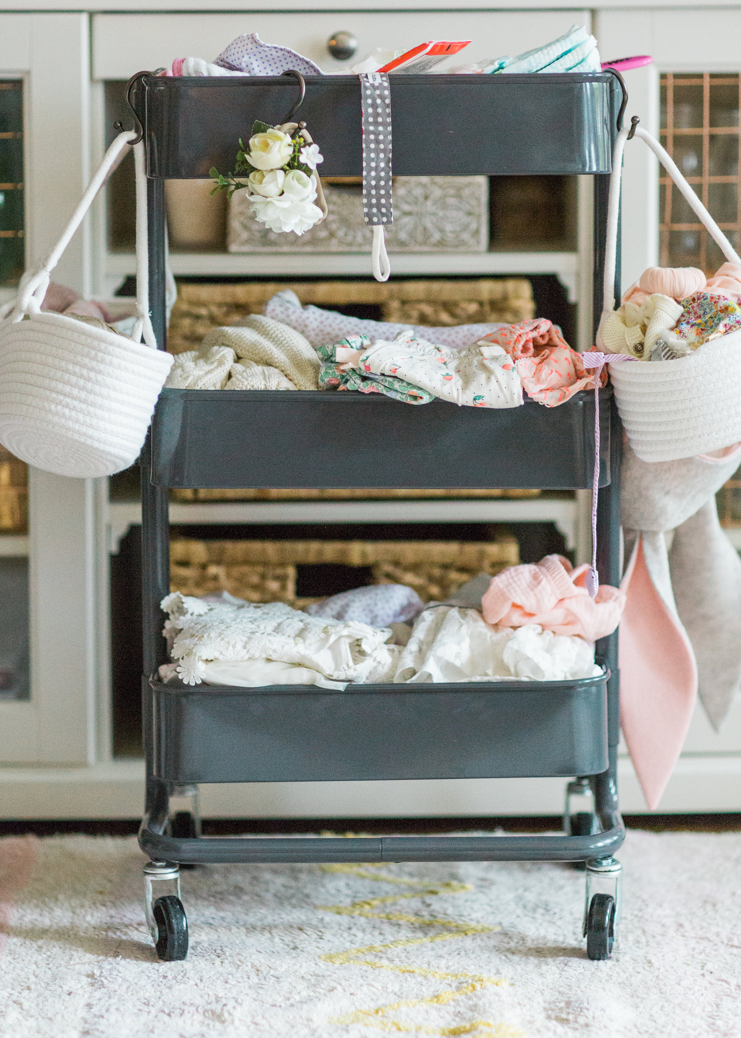 Making life easier with a new baby is the name of the game. Mom blogger Lexi of Glitter, Inc. shares a DIY new baby changing station using everyone's favorite Ikea RÅSKOG Cart. #diy #ikeahack #ikeacart #ikearaskogcart #babychangingstation #babychangingcart #changingstation #changingcart #diaperorganization #baby #newbaby | Click through for the details. | glitterinc.com | @glitterinc