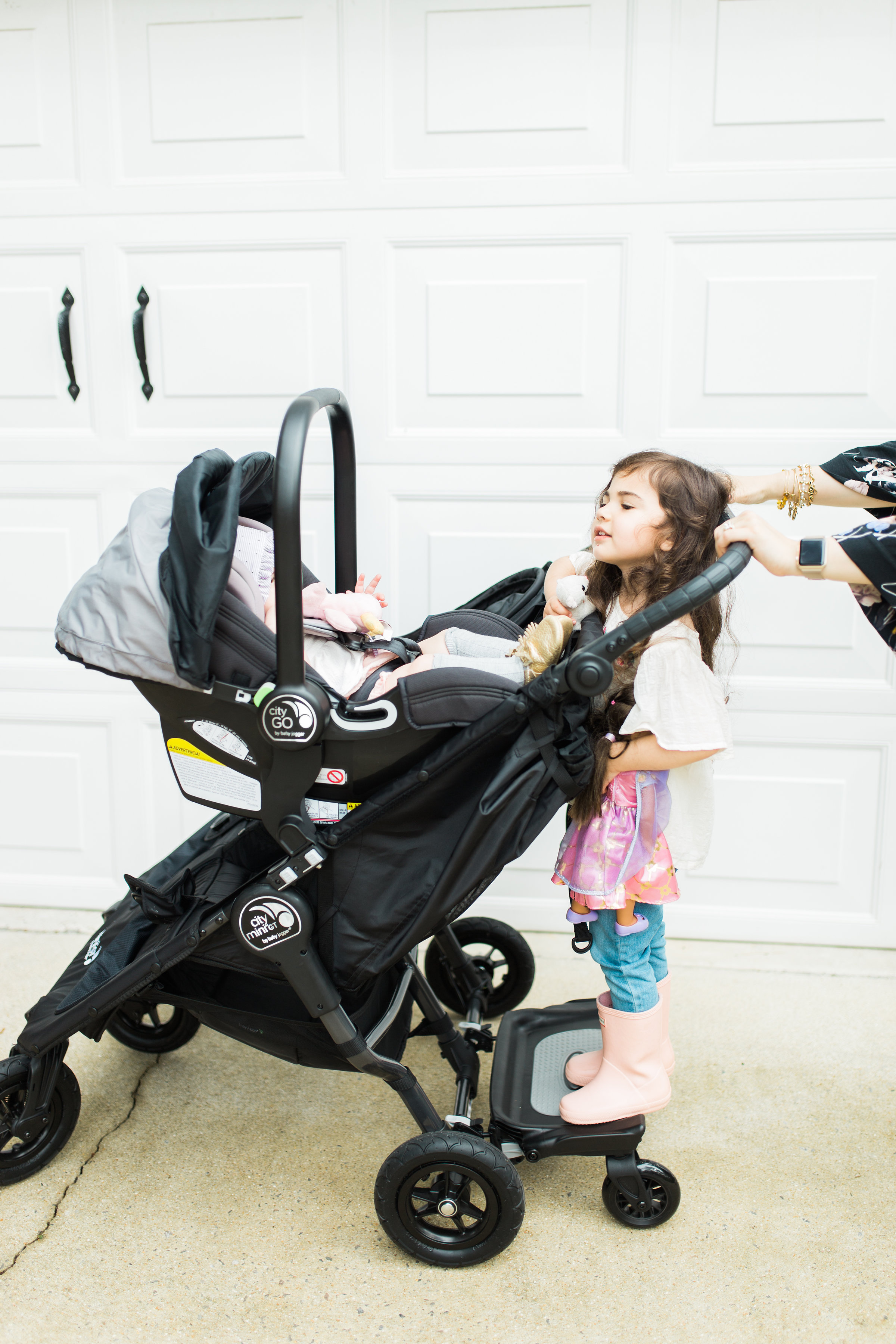 Mom blogger Lexi of Glitter, Inc. reviews the Baby Jogger City Mini GT Double Stroller; and how to decide on the right double stroller for a growing family. #babyjogger #doublestroller #doublestrollerreview #strollerreview #travelsystem #babyjoggercitymini #babyjoggerreview #babyjoggercityminireview Click through for the details. | glitterinc.com | @glitterinc
