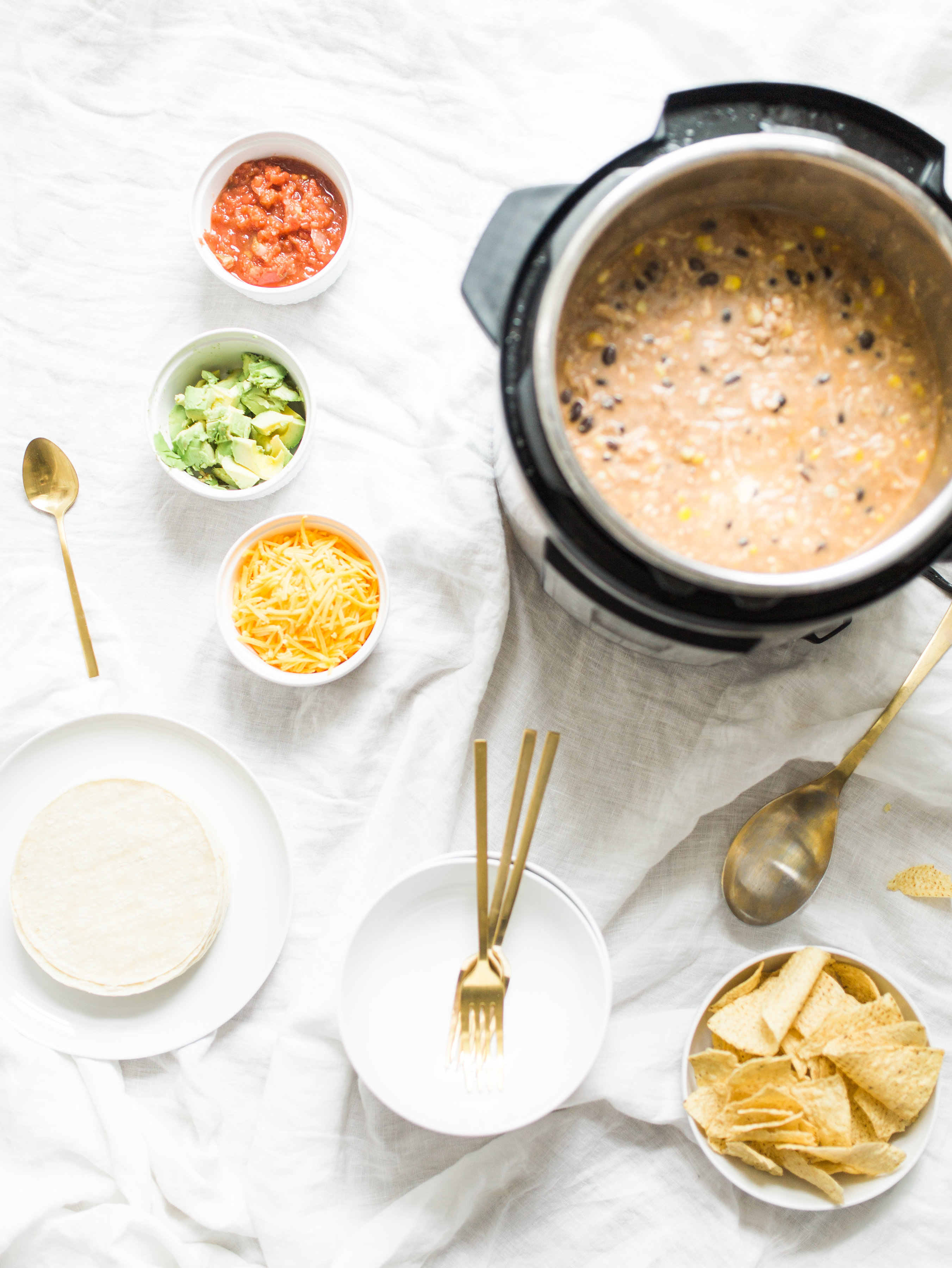 This easy and delicious creamy chicken enchilada soup is made in a crockpot or Instant Pot - a.k.a., dump it and forget it. Our whole family loves it. #crockpot #crockpotmeals #crockpotdinner #instantpot #instantpotdinner #instantpotchicken #crockpotchicken #chickenenchiladas #crockpotenchiladas #instantpotenchiladas #slowcooker #slowcookersoup #slowcookerenchiladas #slowcookermeals Click through for the recipe. | glitterinc.com | @glitterinc