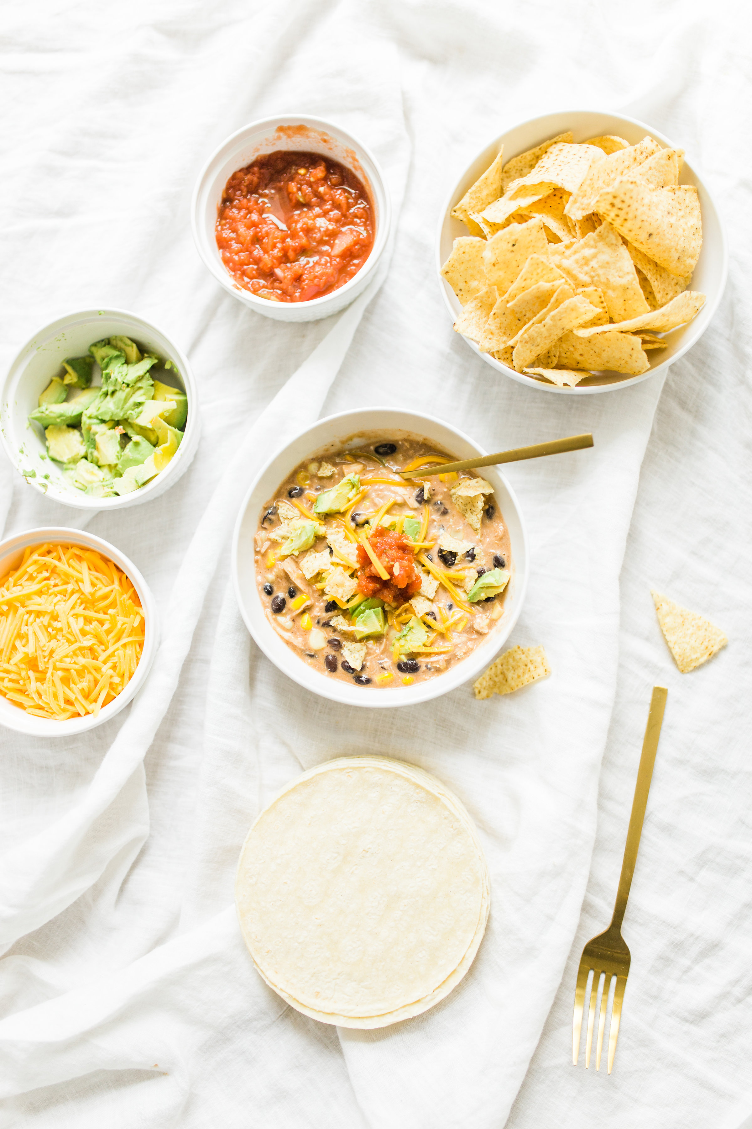 This easy and delicious creamy chicken enchilada soup is made in a crockpot or Instant Pot - a.k.a., dump it and forget it. Our whole family loves it. #crockpot #crockpotmeals #crockpotdinner #instantpot #instantpotdinner #instantpotchicken #crockpotchicken #chickenenchiladas #crockpotenchiladas #instantpotenchiladas #slowcooker #slowcookersoup #slowcookerenchiladas #slowcookermeals Click through for the recipe. | glitterinc.com | @glitterinc