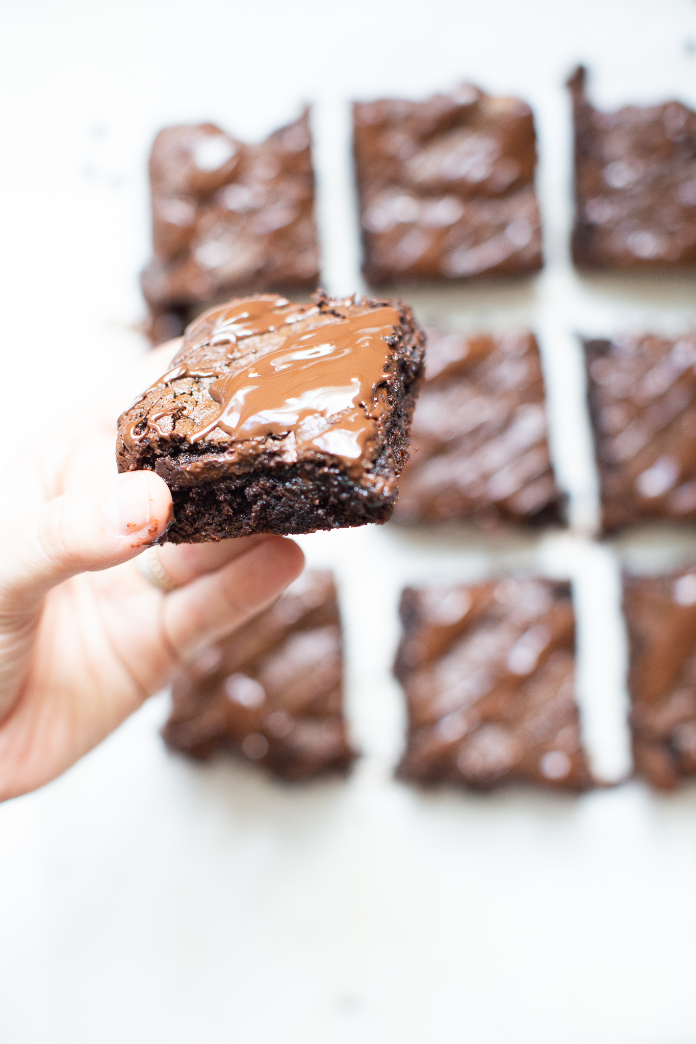 If you've been searching for a guilt-free dessert to satisfy your sweet tooth, then look no further than these magical fudgy tahini brownies. They are easily one of my favorite brownie recipes EVER! #brownies #healthydessert #tahinibrownies #glutenfree #dairyfree #paleo #grainfree | glitterinc.com | @glitterinc