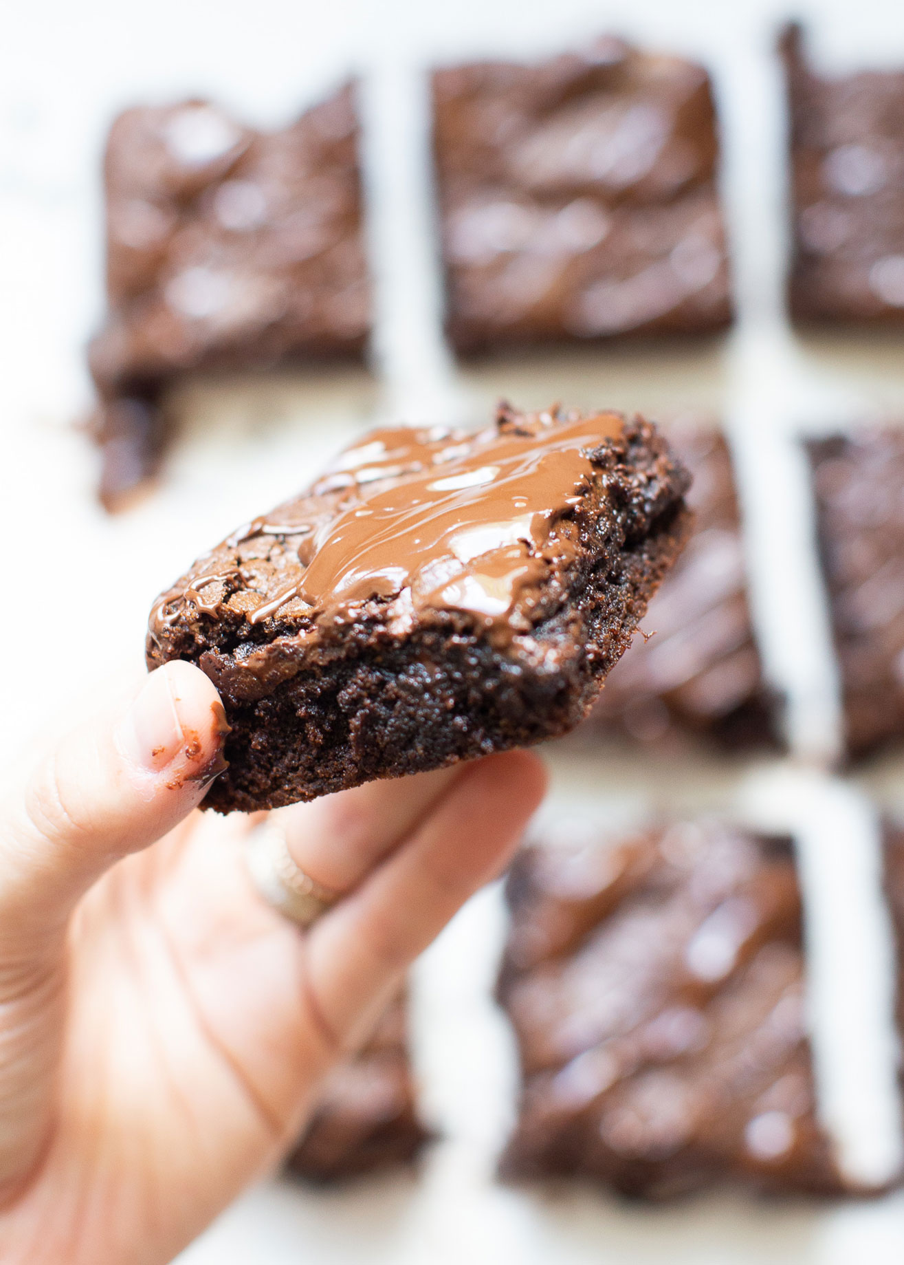 If you've been searching for a guilt-free dessert to satisfy your sweet tooth, then look no further than these magical fudgy tahini brownies. They are easily one of my favorite brownie recipes EVER! #brownies #healthydessert #tahinibrownies #glutenfree #dairyfree #paleo #grainfree | glitterinc.com | @glitterinc