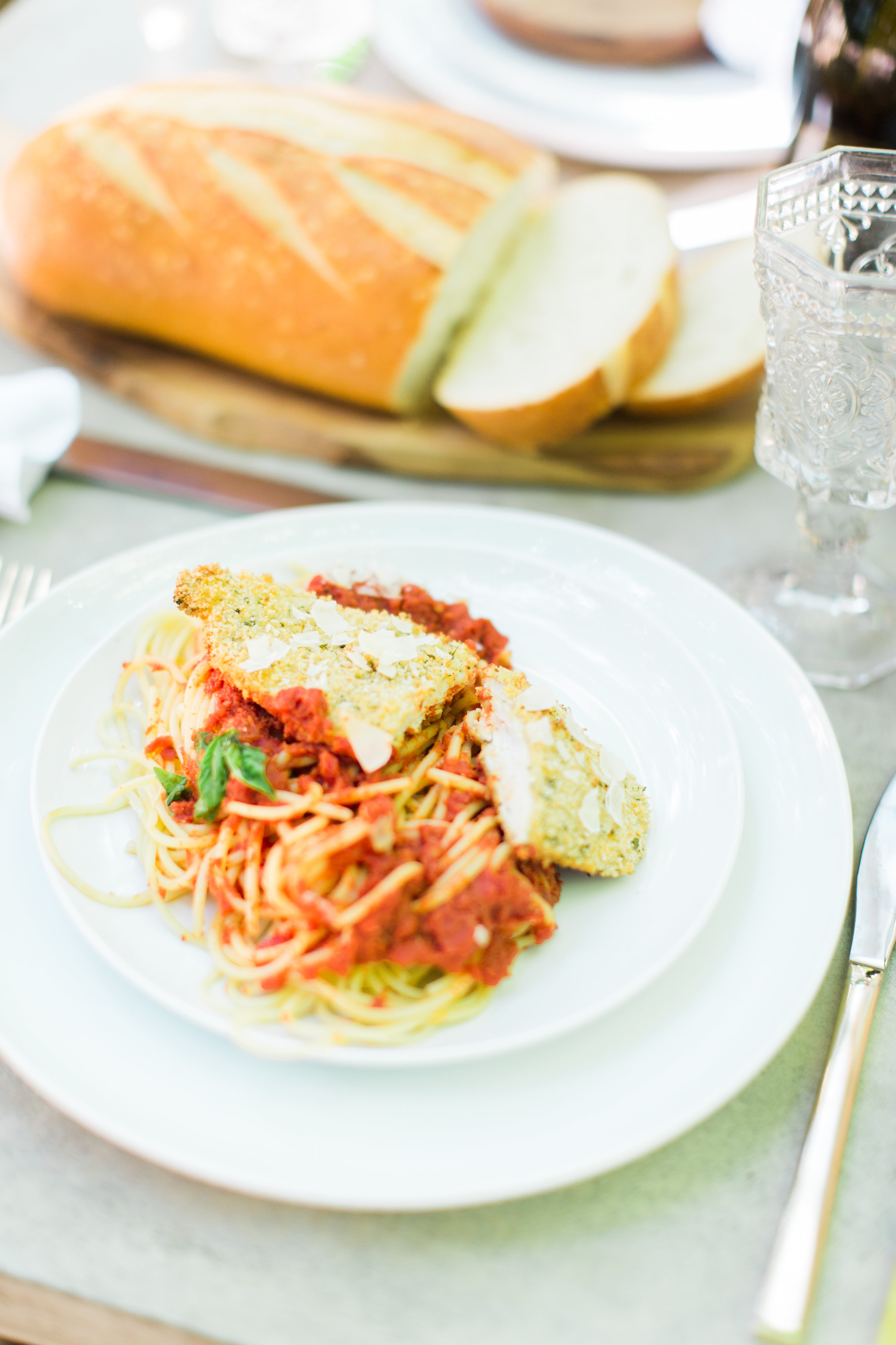 Throw an easy, light-hearted, and fun get-together for friends and family with one of our favorites - the spaghetti dinner party. Sharing how we throw a memorable spaghetti dinner - that everyone will love - in just a few simple steps! #dinnerparty #spaghettidinner #pastadinner #italiandinnerparty Click through for the details. | glitterinc.com | @glitterinc