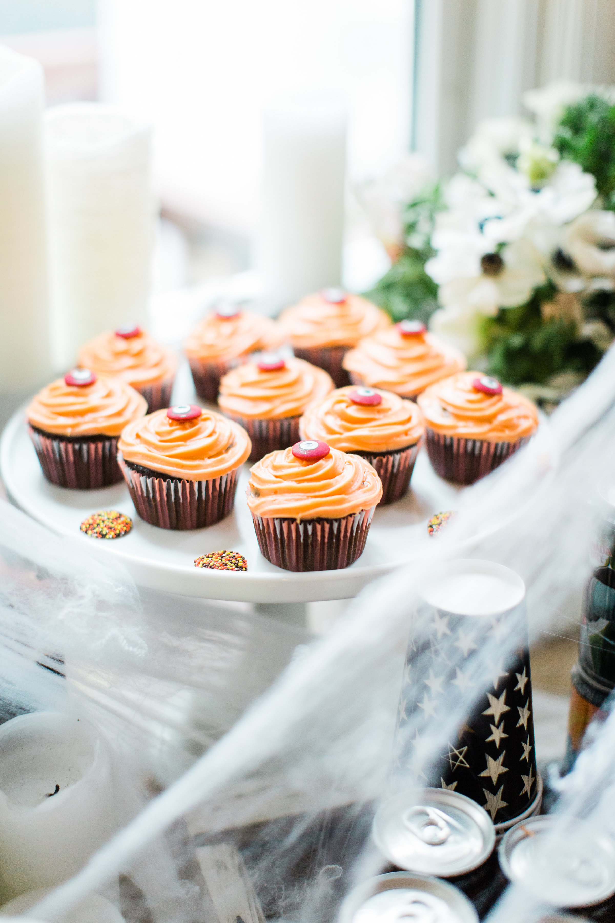 Halloween Party Station for your next haunted bash! #Halloween #HalloweenParty #HalloweenDecor #halloweencandy #halloweendessert #dessertstation Click through for the scary fun details. | glitterinc.com | @glitterinc