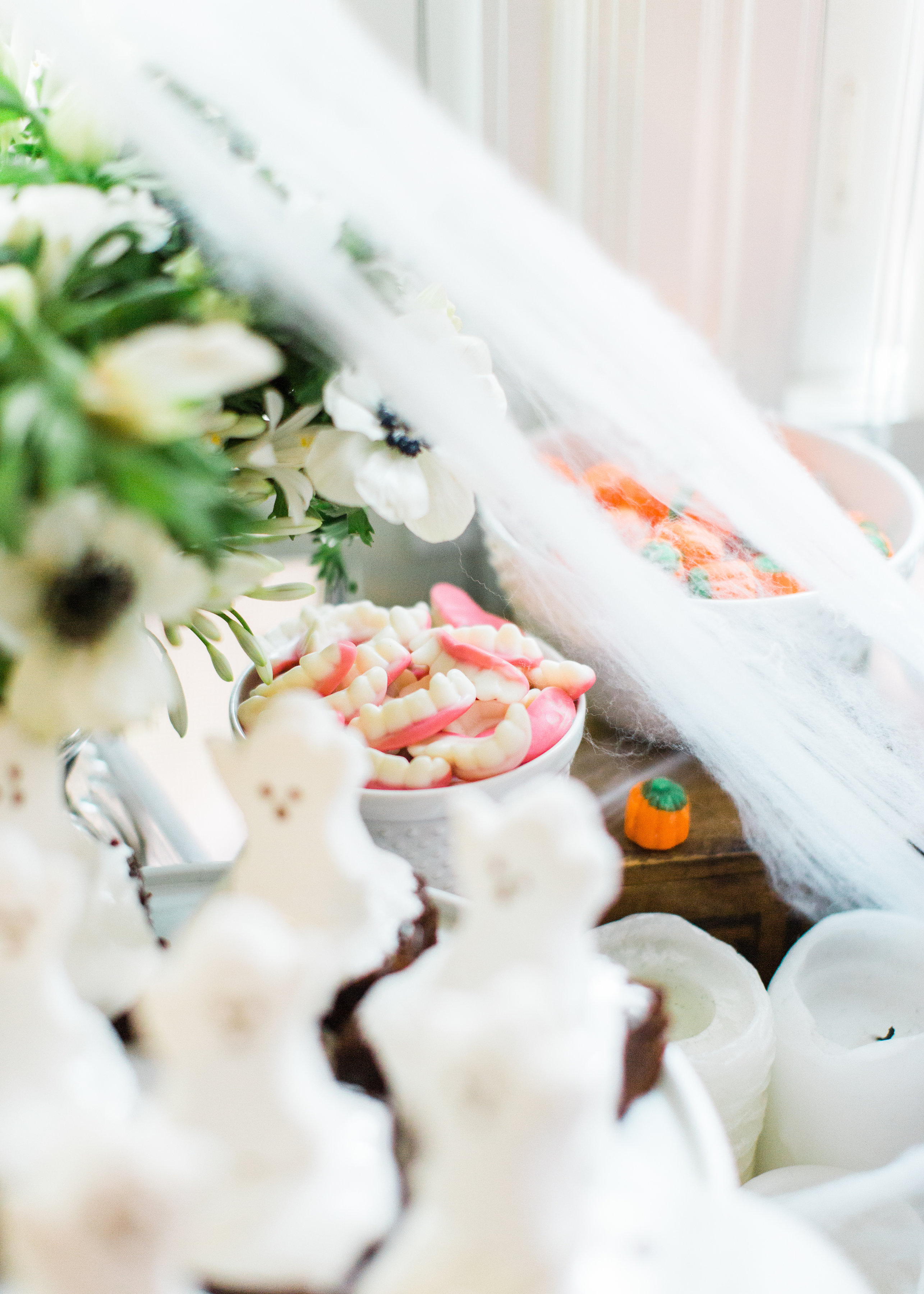 Create your own spooky Eat, Sip, and Be Scary Halloween Party Station for your next haunted bash! #Halloween #HalloweenParty #HalloweenDecor #halloweencandy #halloweendessert #dessertstation Click through for the scary fun details. | glitterinc.com | @glitterinc