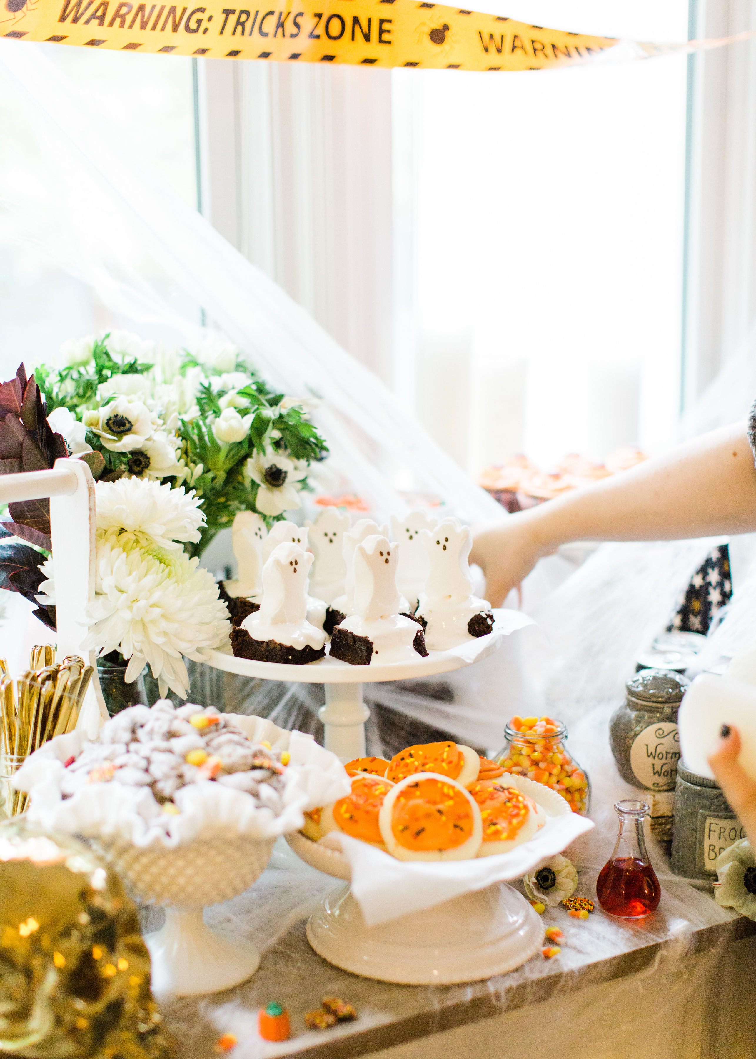 Create your own spooky Eat, Sip, and Be Scary Halloween Party Station for your next haunted bash! #Halloween #HalloweenParty #HalloweenDecor #halloweencandy #halloweendessert #dessertstation Click through for the scary fun details. | glitterinc.com | @glitterinc