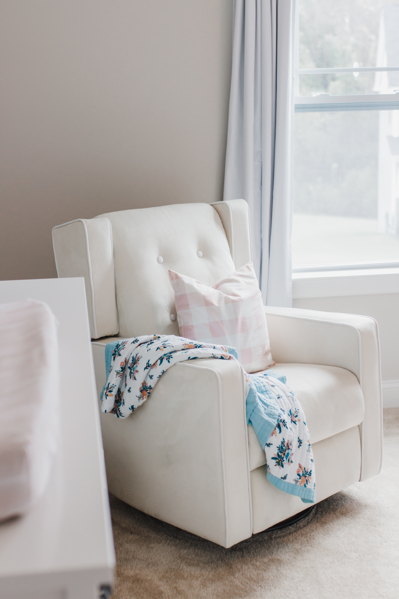 Step inside this gorgeous baby girl's nursery in soft blue and blush tones. Click through for the details. #nursery #babygirl #girlsroom #girlsnursery #girlnursery #girlroom #baby #newbaby | glitterinc.com | @glitterinc