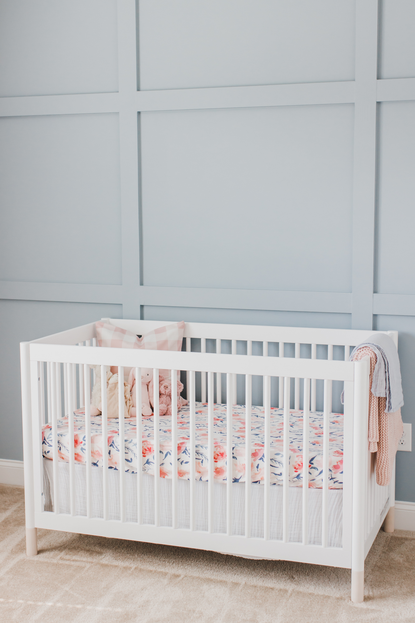 Step inside this gorgeous baby girl's nursery in soft blue and blush tones. Click through for the details. #nursery #babygirl #girlsroom #girlsnursery #girlnursery #girlroom #baby #newbaby | glitterinc.com | @glitterinc