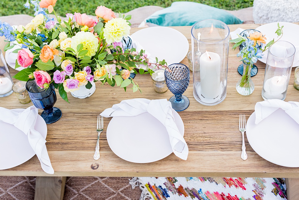 Step inside this colorful outdoor bohemian thirtieth birthday party. Full of color, lush garden flowers, and the yummiest vegan unicorn confetti cakes you ever did find! Click through for the details. Mikkel Paige Photography #gardenparty #birthdayparty #bohemianparty #unicornparty #styledshoot #flowers | glitterinc.com | @glitterinc