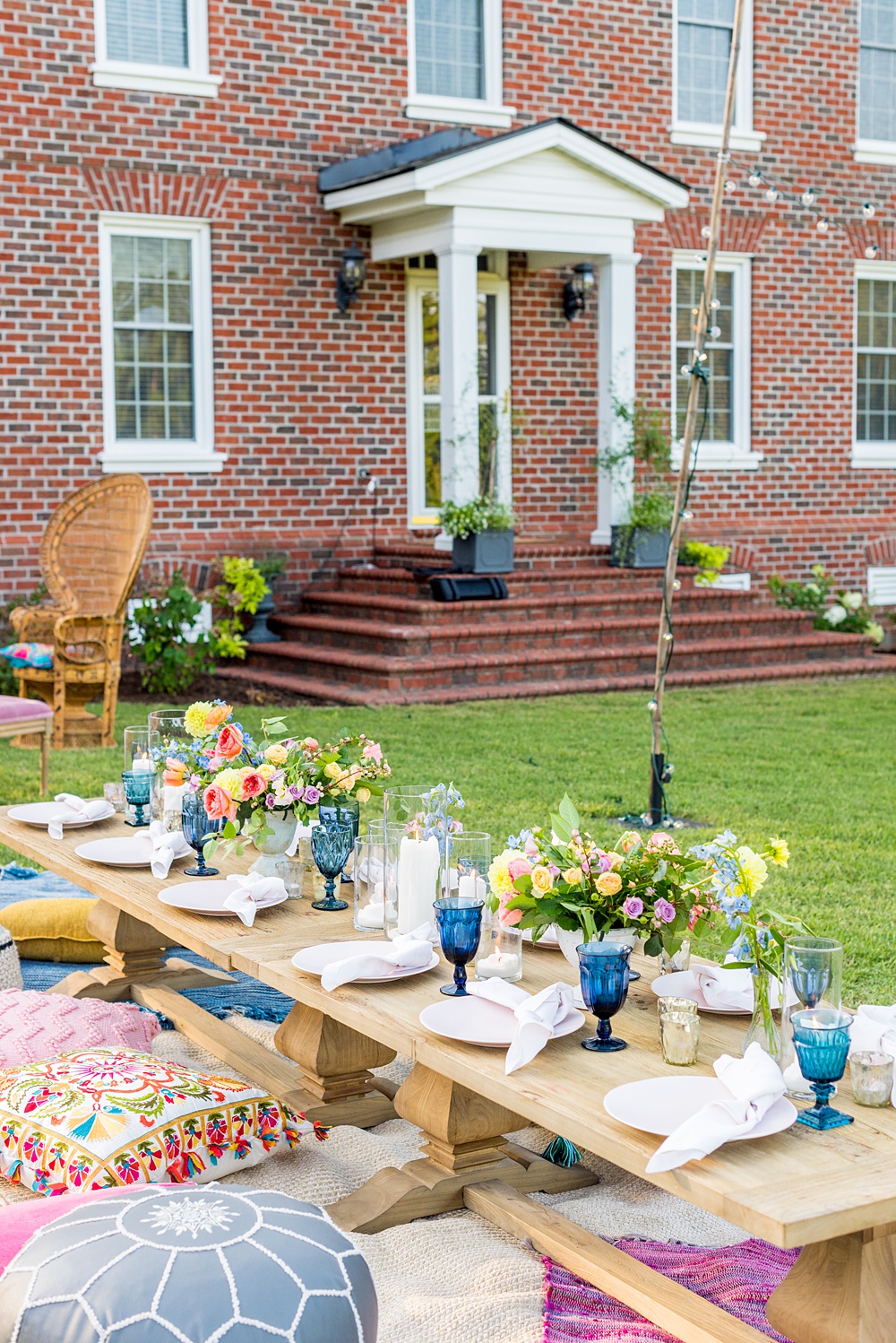 Step inside this colorful outdoor bohemian thirtieth birthday party. Full of color, lush garden flowers, and the yummiest vegan unicorn confetti cakes you ever did find! Mikkel Paige Photography #gardenparty #birthdayparty #bohemianparty #unicornparty #styledshoot #backyardparty #flowers | glitterinc.com | @glitterinc