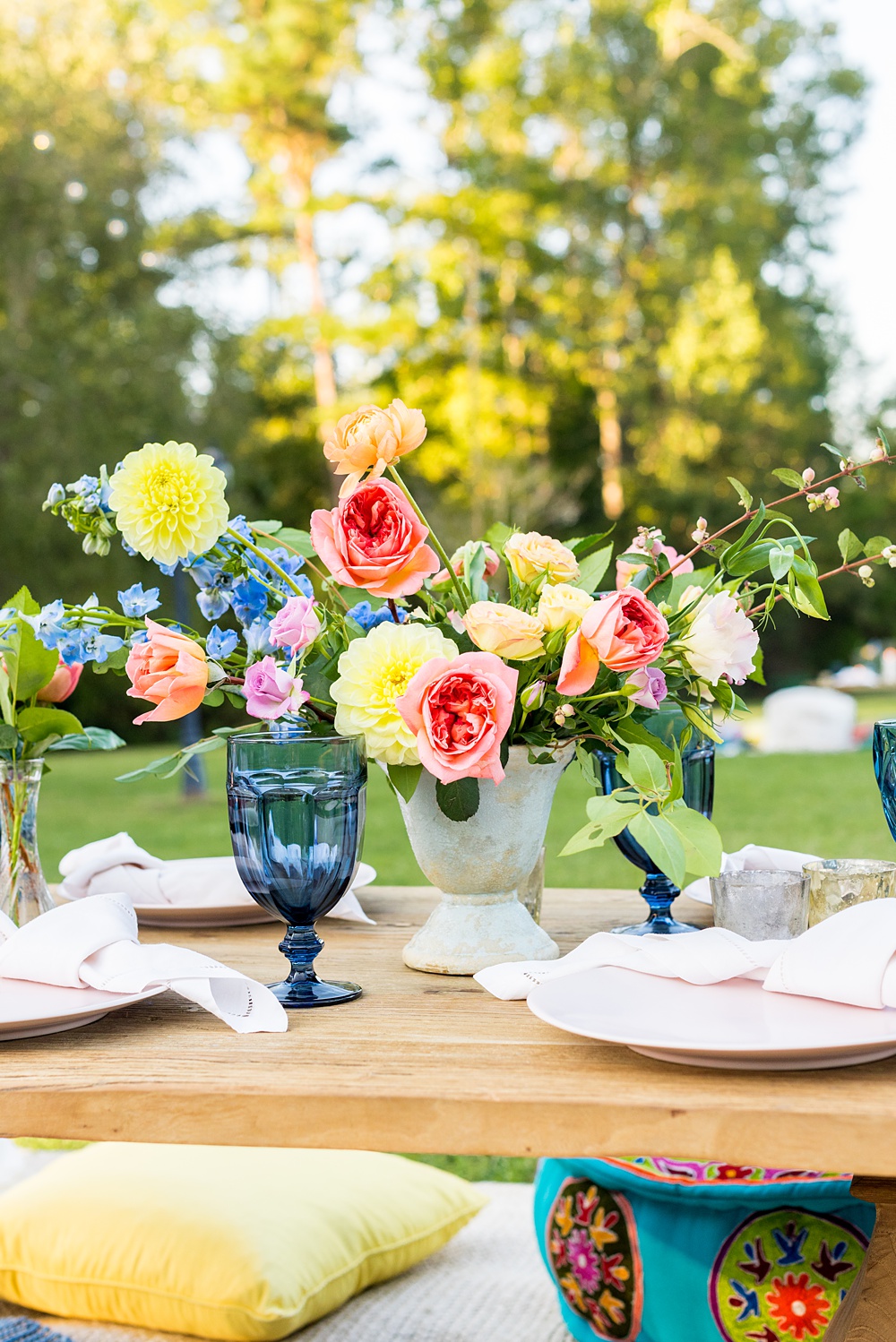 Step inside this colorful outdoor bohemian thirtieth birthday party. Full of color, lush garden flowers, and the yummiest vegan unicorn confetti cakes you ever did find! Click through for the details. Mikkel Paige Photography #gardenparty #birthdayparty #bohemianparty #unicornparty #styledshoot #backyardparty #flowers | glitterinc.com 