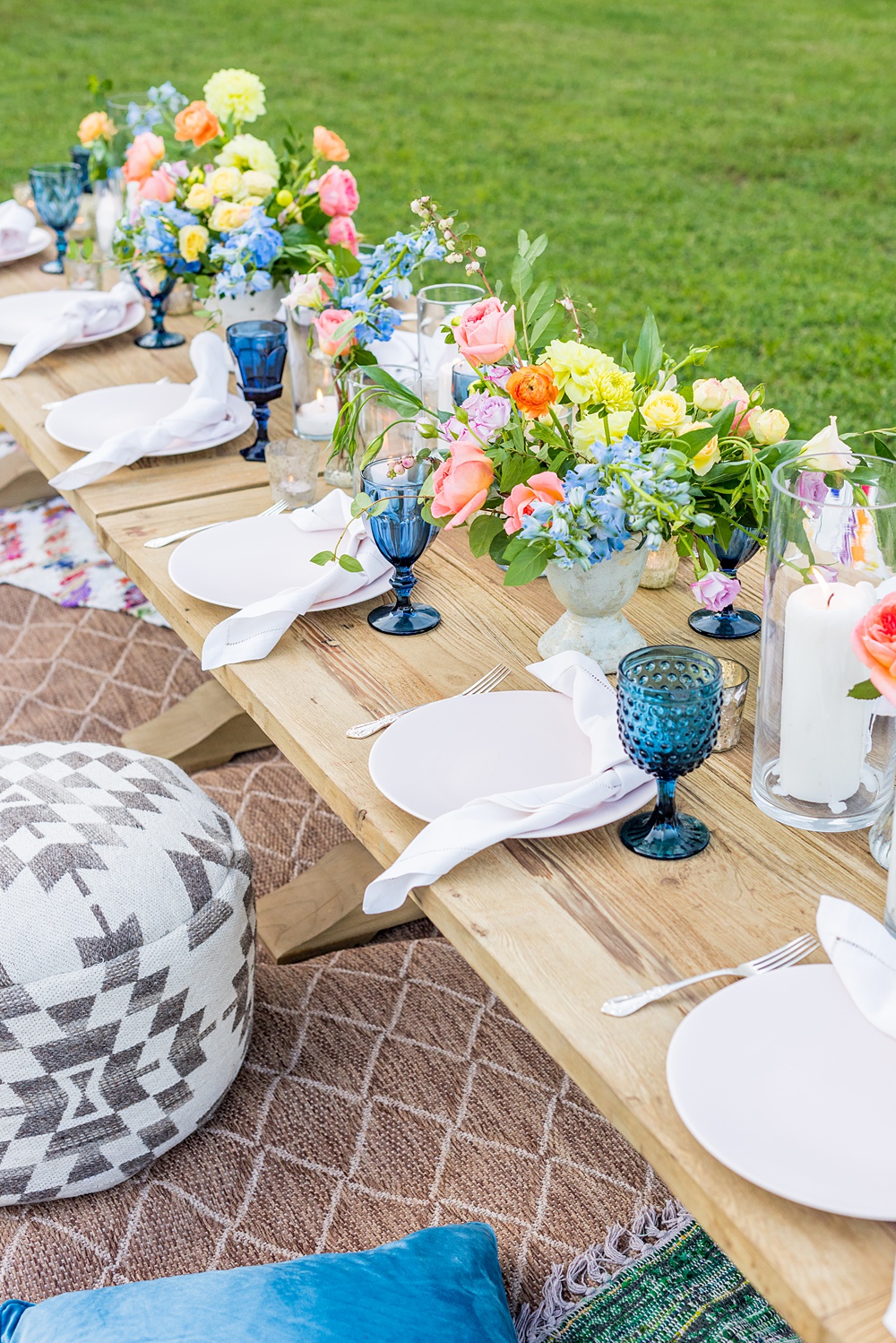 Step inside this colorful outdoor bohemian thirtieth birthday party. Full of color, lush garden flowers, and the yummiest vegan unicorn confetti cakes you ever did find! Click through for the details. Mikkel Paige Photography #gardenparty #bohemianparty #unicornparty #styledshoot #backyardparty #flowers | glitterinc.com | @glitterinc