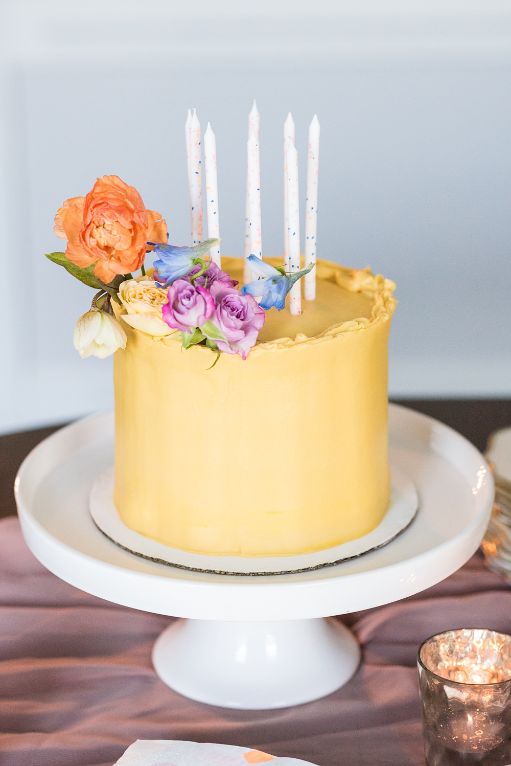 Step inside this colorful outdoor bohemian thirtieth birthday party. Full of color, lush garden flowers, and the yummiest vegan unicorn confetti cakes you ever did find! Click through for the details. Mikkel Paige Photography #gardenparty #birthdayparty #bohemianparty #unicornparty #styledshoot #backyardparty #flowers | glitterinc.com | @glitterinc