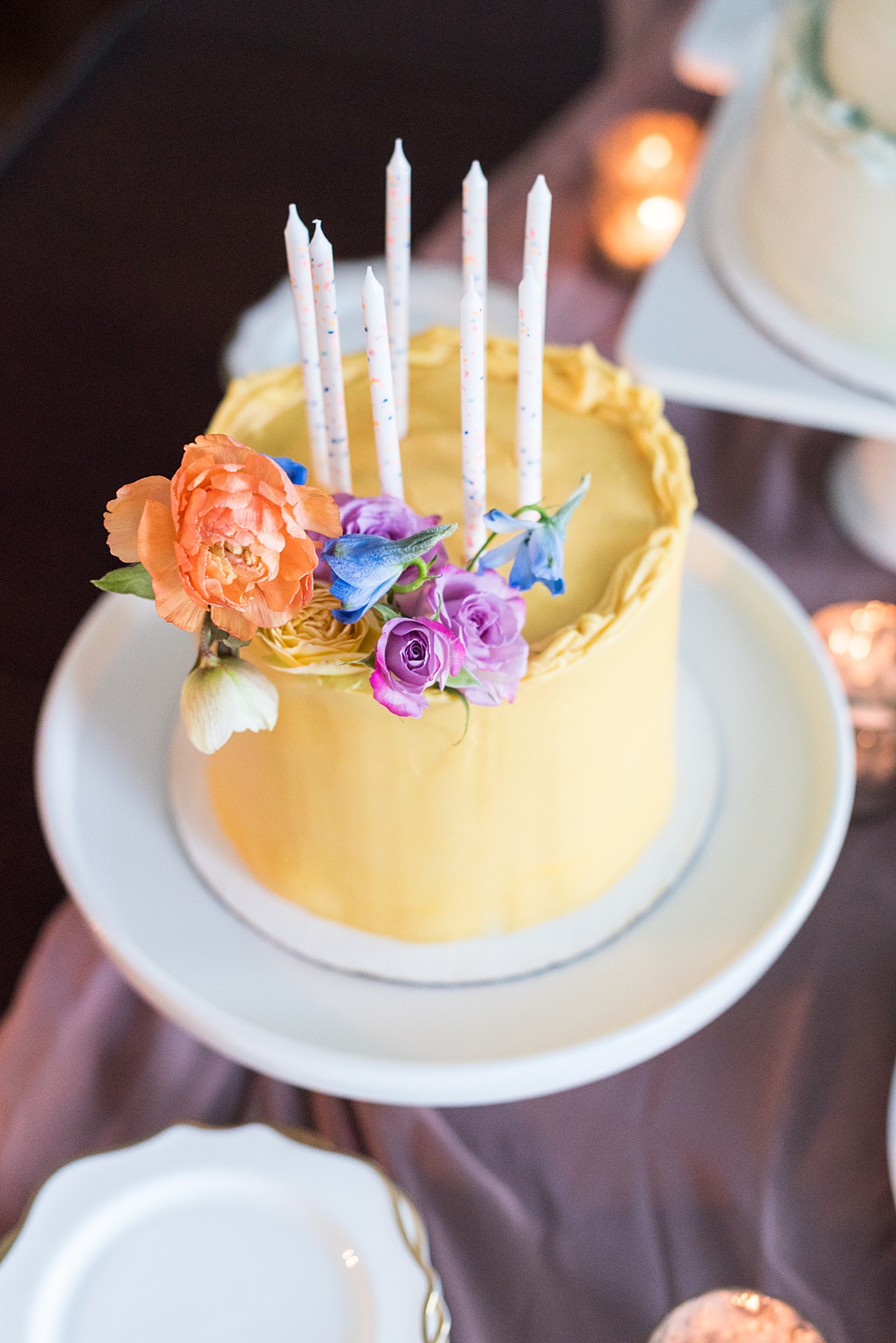 Step inside this colorful outdoor bohemian thirtieth birthday party. Full of color, lush garden flowers, and the yummiest vegan unicorn confetti cakes you ever did find! Click through for the details. Mikkel Paige Photography #gardenparty #birthdayparty #bohemianparty #unicornparty #styledshoot #backyardparty #flowers | glitterinc.com | @glitterinc