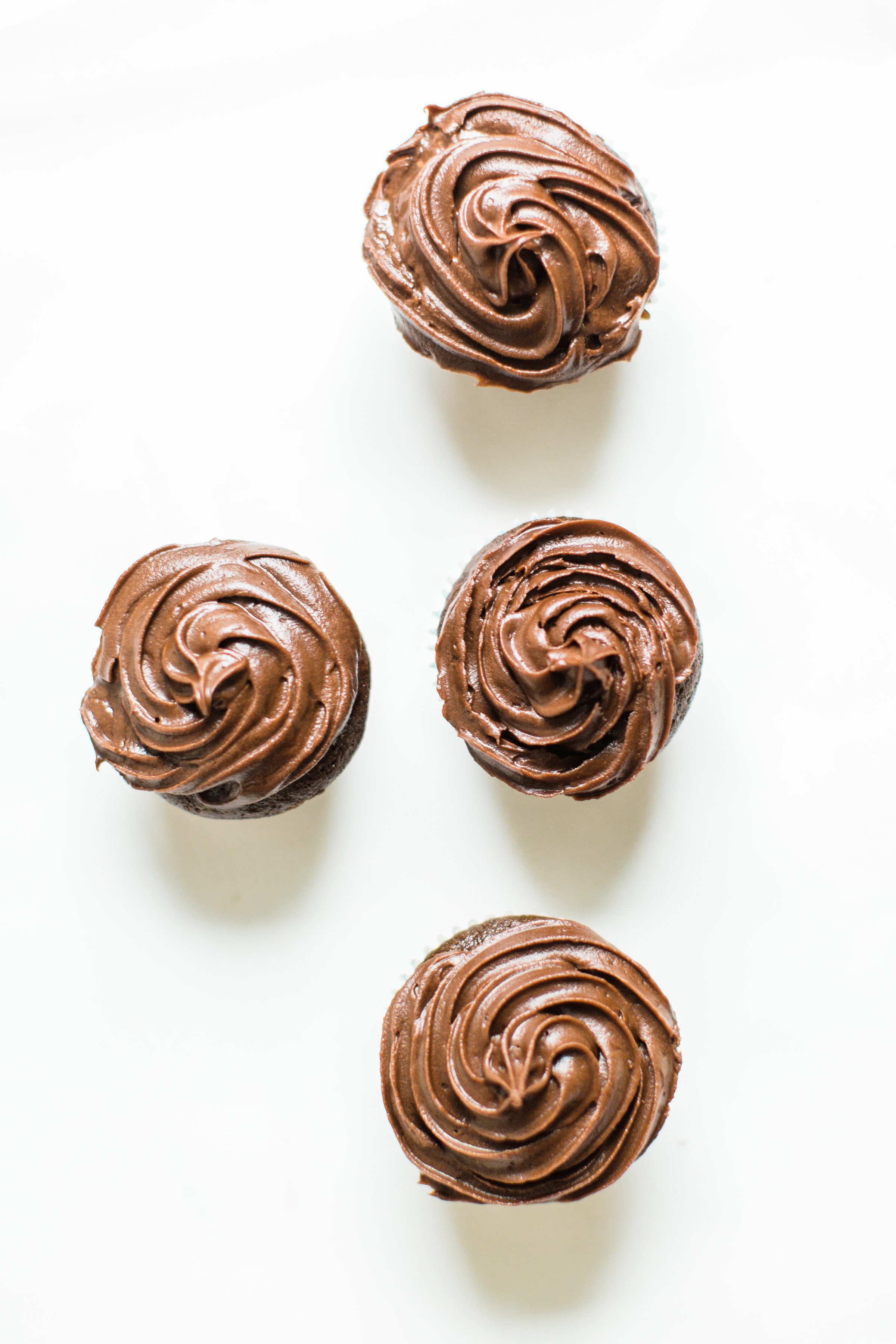 Make these fluffy, moist, and delicious chocolate cupcakes with our favorite chocolate crazy cake recipe. These easy egg-free and dairy-free cupcakes are perfect for your next party! | glitterinc.com | @glitterinc