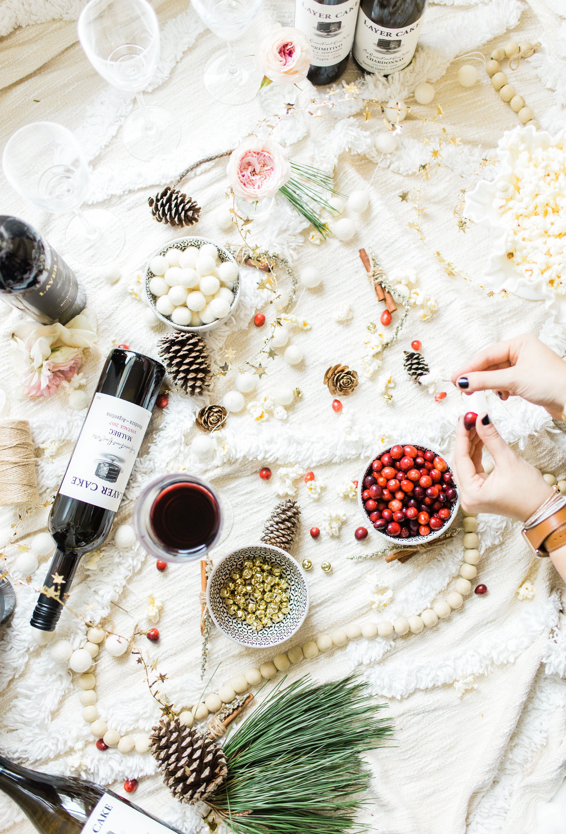  Sip on wine and nibble on snacks while you make a beautiful DIY holiday garland with friends! (Bonus: The DIY holiday garland making party sets the stage for the perfect girls night in!) Click through for the details. #holidayparty #christmasparty #diychristmas #diyholidays #garland #holidaygarland #diyholidaygarland #diygarland #christmasgarland #holidaygirlsnight #christmasgirlsnight | glitterinc.com | @glitterinc