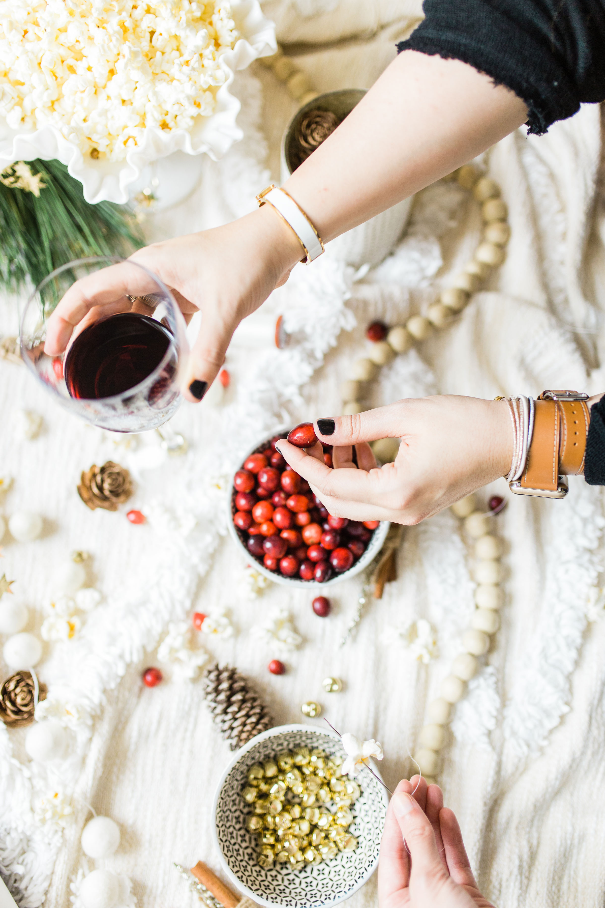 Looking for your next holiday party idea? Sip on wine and nibble on snacks while you make beautiful DIY holiday garlands with friends! (Bonus: The DIY holiday garland making party sets the stage for the perfect girls night in!) Click through for the details. #holidayparty #christmasparty #diychristmas #diyholidays #garland #holidaygarland #diyholidaygarland #diygarland #christmasgarland #holidaygirlsnight #christmasgirlsnight | glitterinc.com | @glitterinc