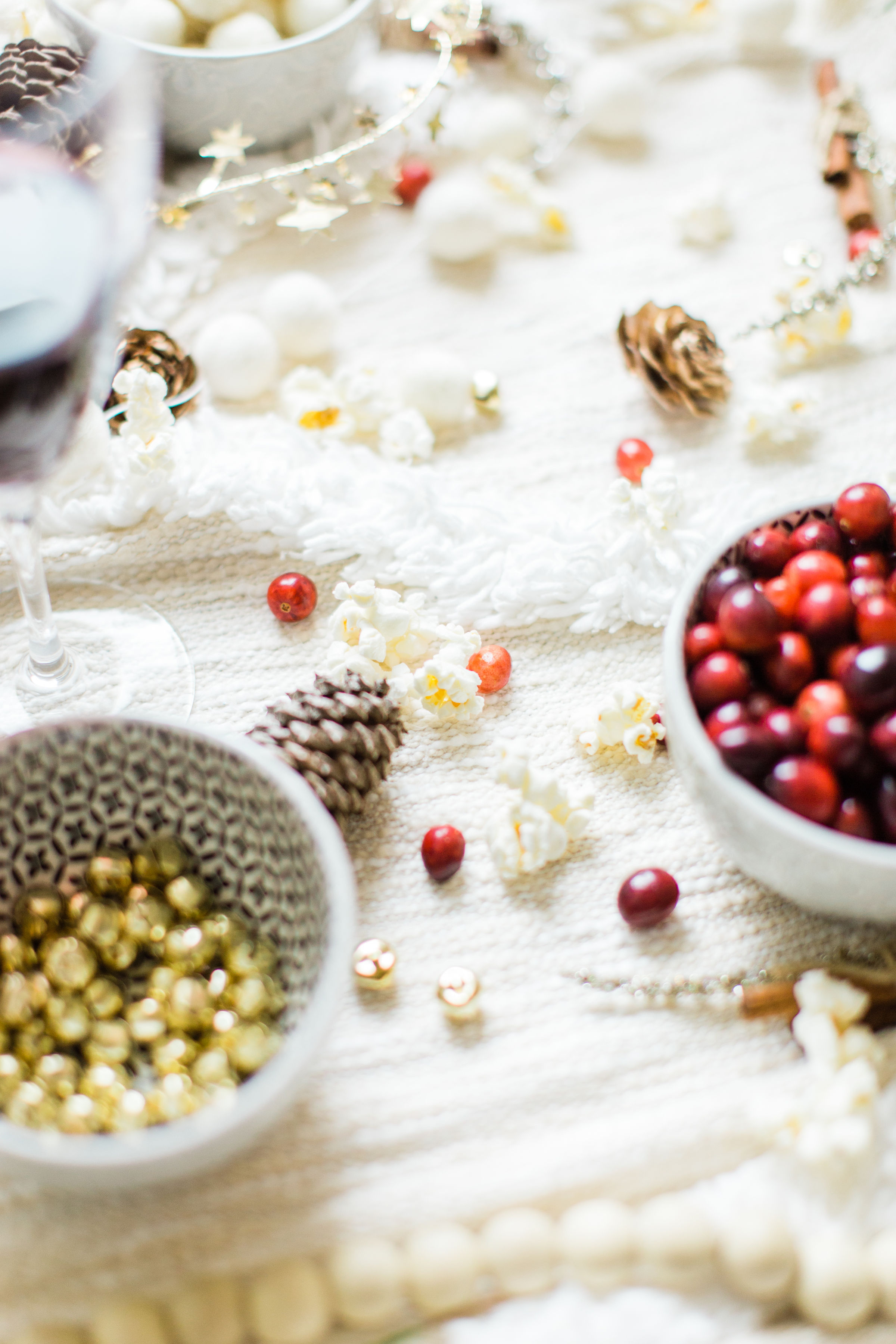 Looking for your next holiday party idea? Sip on wine and nibble on snacks while you make beautiful DIY holiday garlands with friends! (Bonus: The DIY holiday garland making party sets the stage for the perfect girls night in!) Click through for the details. #holidayparty #christmasparty #diychristmas #diyholidays #garland #holidaygarland #diyholidaygarland #diygarland #christmasgarland #holidaygirlsnight #christmasgirlsnight | glitterinc.com | @glitterinc