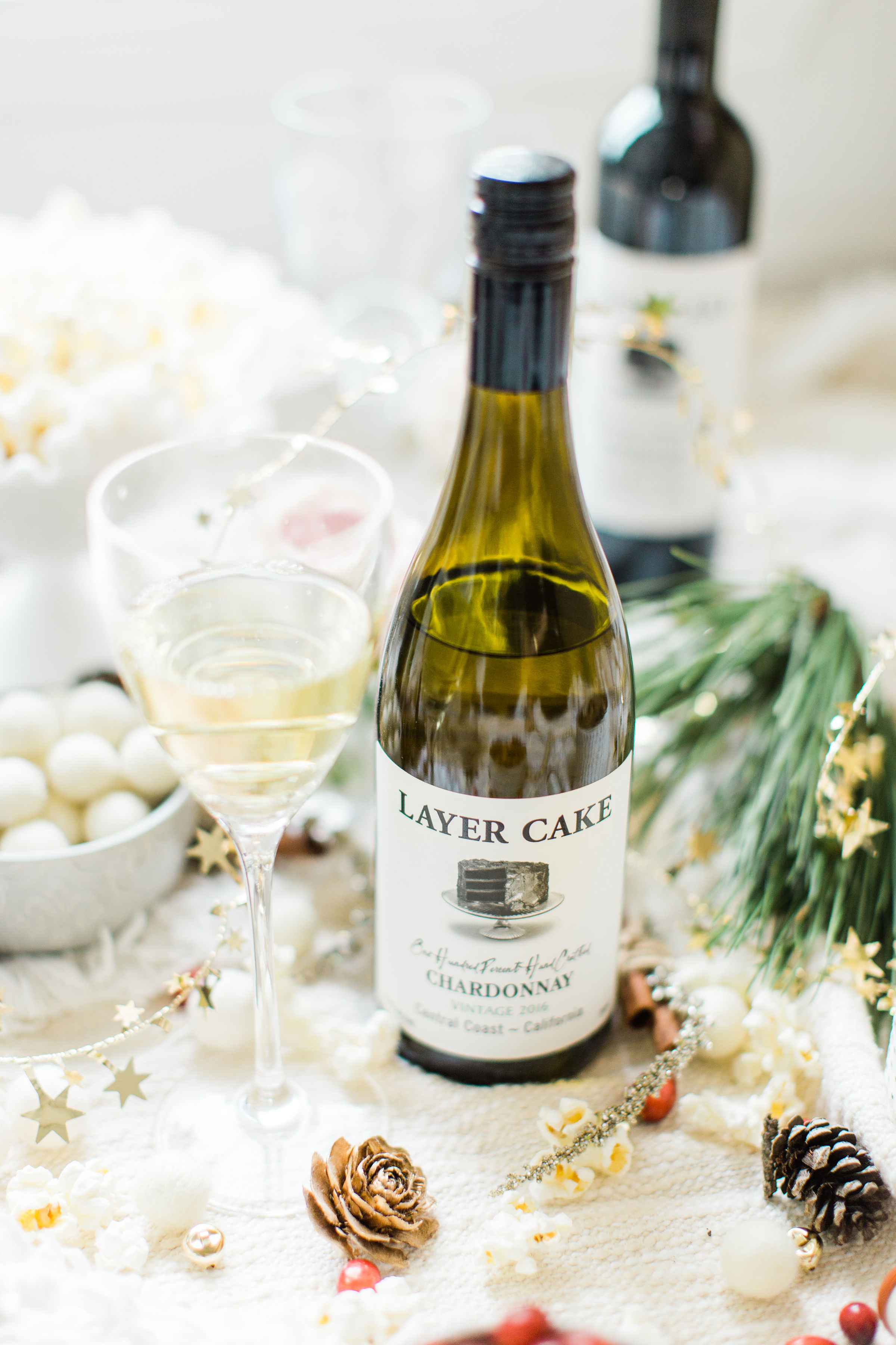 Layer Cake Wine. #holidayparty #christmasparty #diychristmas #diyholidays #garland #holidaygarland #diyholidaygarland #diygarland #christmasgarland #holidaygirlsnight #christmasgirlsnight | glitterinc.com | @glitterinc