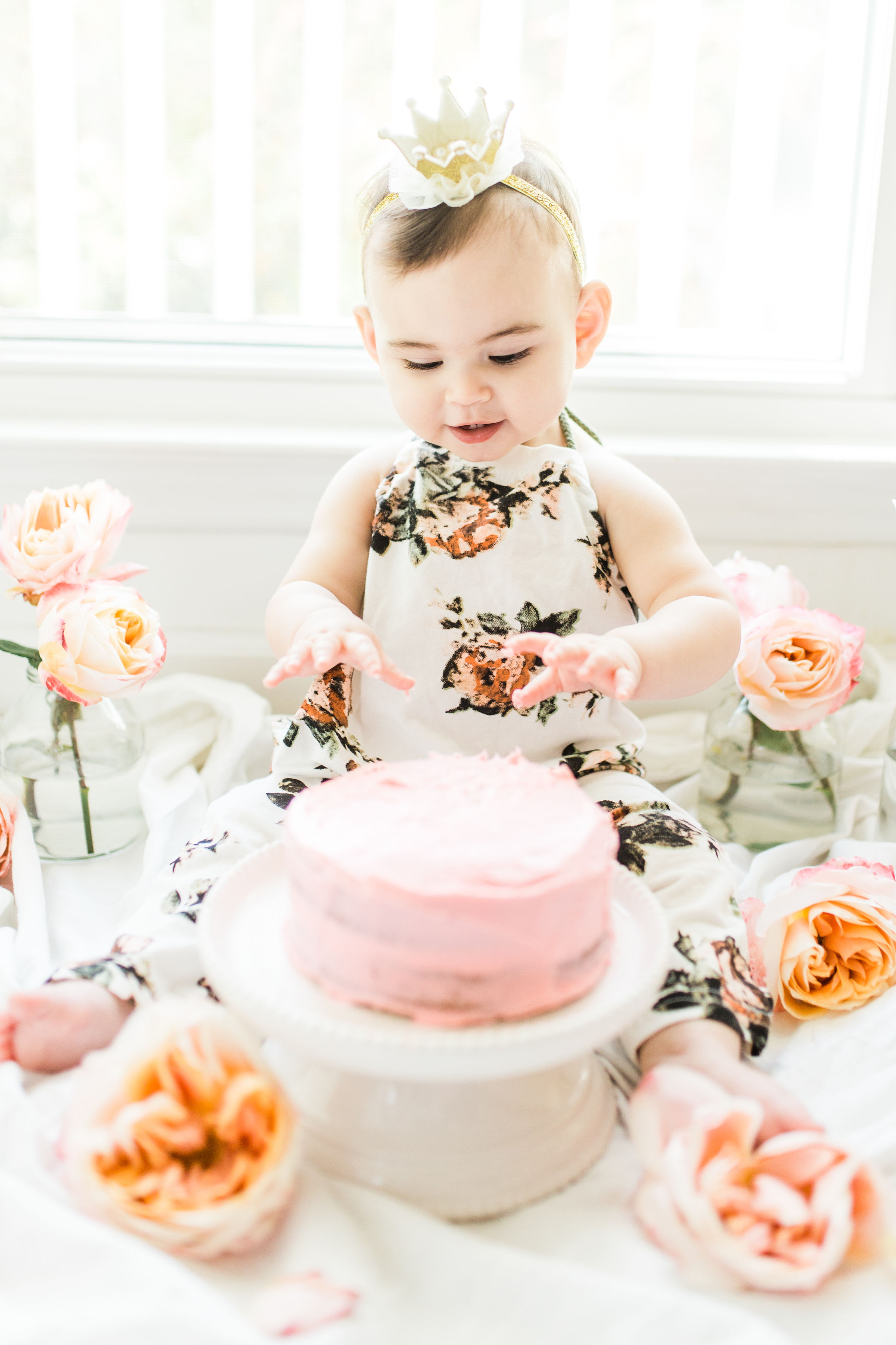 Looking for a little inspiration for baby's first birthday cake smash photo shoot? We're keeping it simple and adorable for Emmeline's cake smash, plus, we're sharing our favorite dairy-free vanilla crazy cake recipe! Click through for the details and #recipe. #firstbirthday #babybirthday #cakesmash #babycakesmash #cakesmashrecipe #firstbirthdaycake | glitterinc.com | @glitterinc