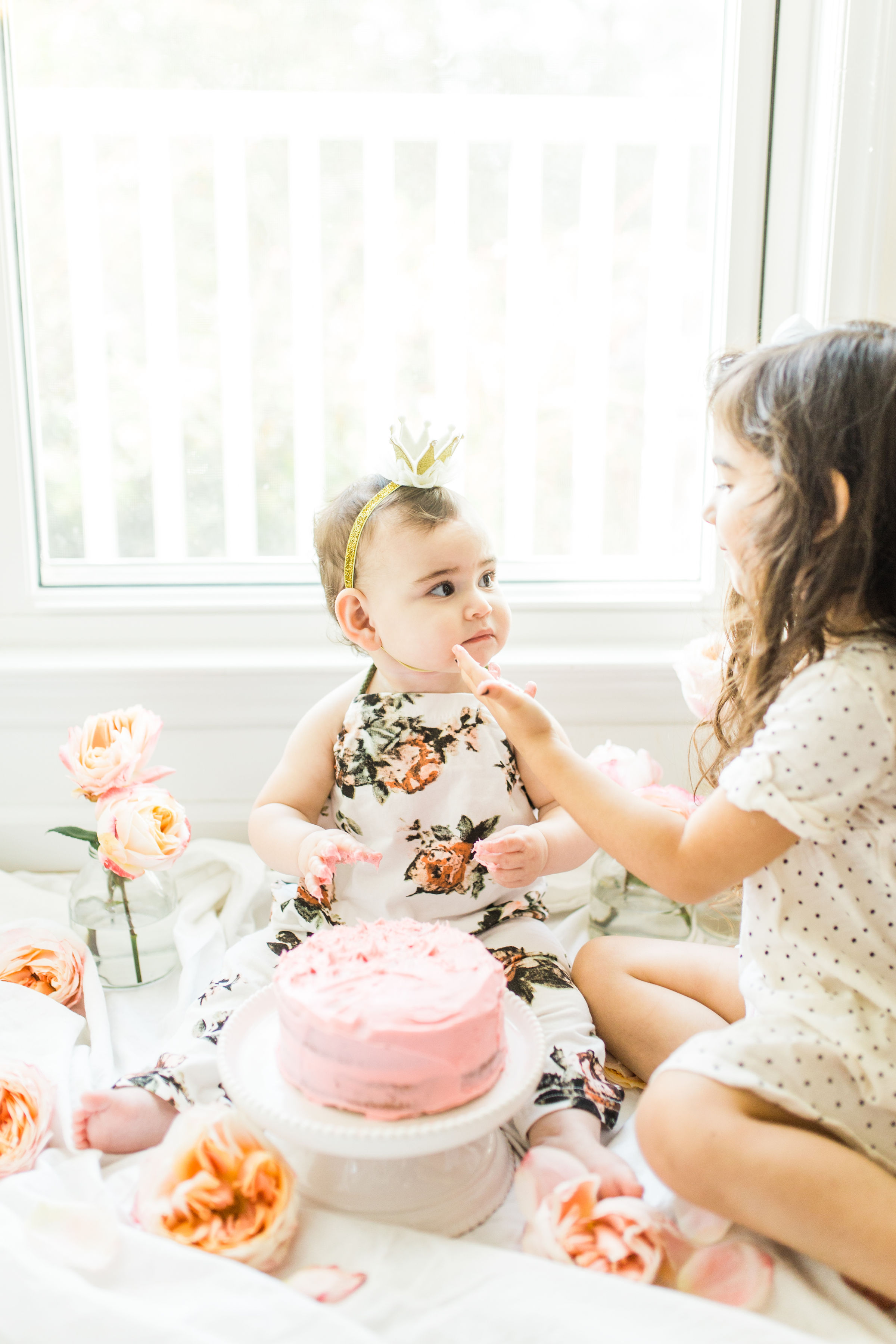 Looking for a little inspiration for baby's first birthday cake smash photo shoot? We're keeping it simple and adorable for Emmeline's cake smash, plus, we're sharing our favorite dairy-free vanilla crazy cake recipe! Click through for the details and #recipe. #firstbirthday #babybirthday #cakesmash #babycakesmash #cakesmashrecipe #firstbirthdaycake | glitterinc.com | @glitterinc