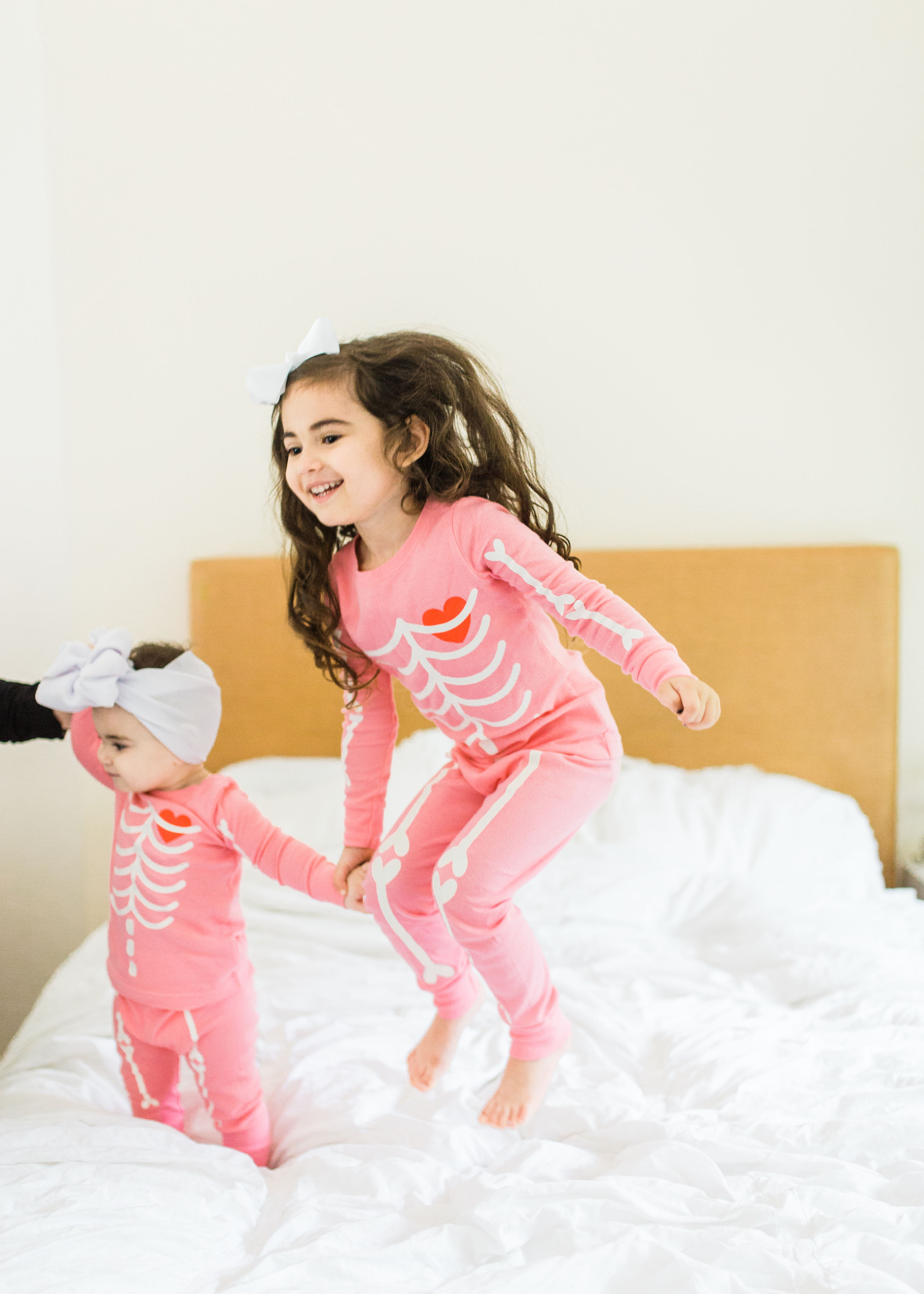 Looking to start a few fun Halloween family traditions? We're sharing our favorites, including a roundup of the best Halloween movies for kids, the cutest matching Halloween pajamas for your little ones, and plenty of spooky party inspiration and recipes! Click through for the details. #halloween #halloweenpajamas #halloweenideas #halloweentraditions #familyhalloween #kidshalloween #kidshalloweenfun #kidshalloweenpajamas  | glitterinc.com | @glitterinc