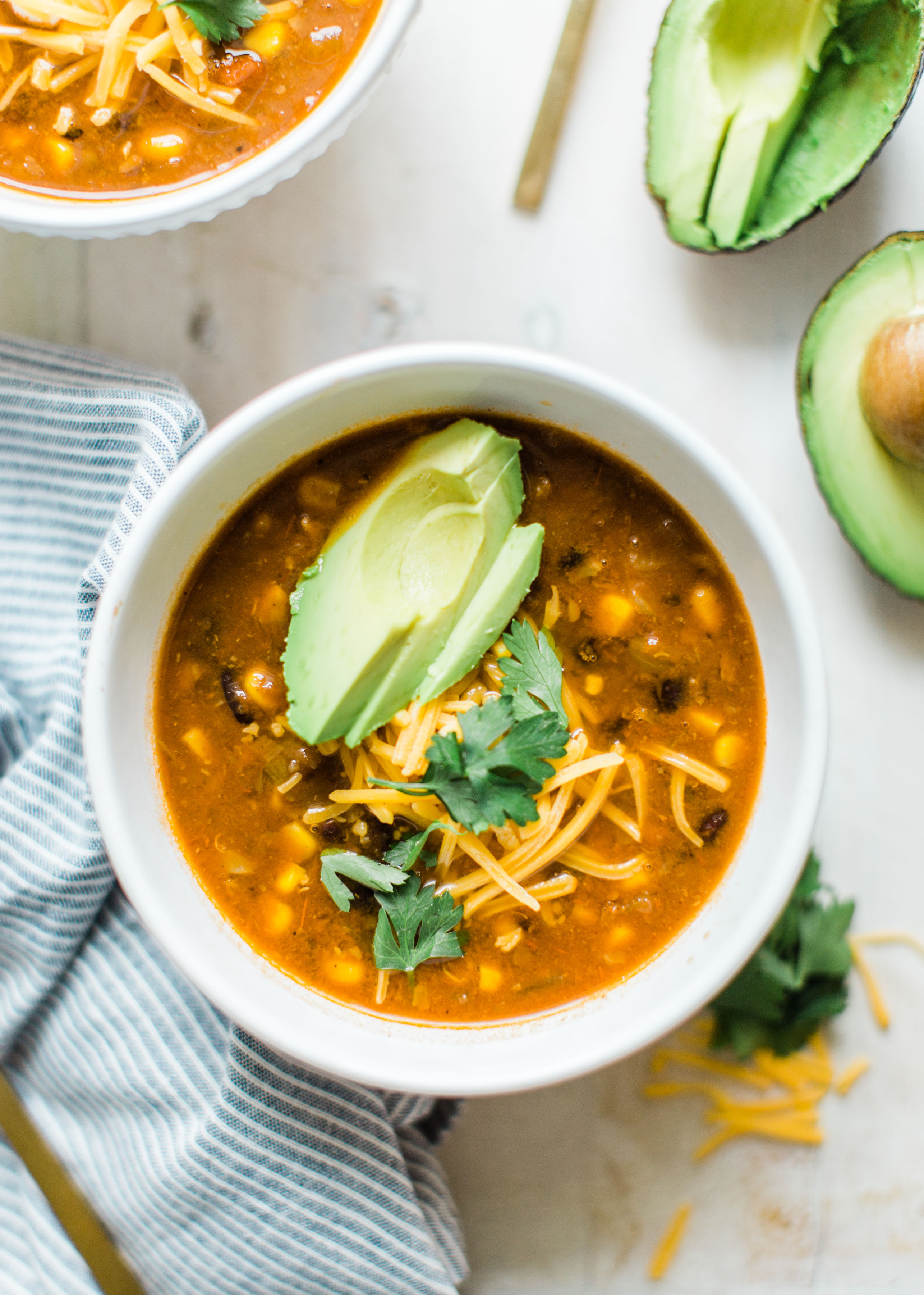 Obsessed with Trader Joe's Harvest Chili? Looking to whip up a delicious family dinner on a budget? Make your own easy copycat crockpot Trader Joe's harvest chili. (Say that three times fast!) This soup is vegetarian and so yummy. Click through for the recipe. #harvestchili #traderjoes #vegetarianchili #soup #vegetariansoup #crockpotchili #crockpotsoup #instantpot #crockpot #instantpotchili | glitterinc.com | @glitterinc